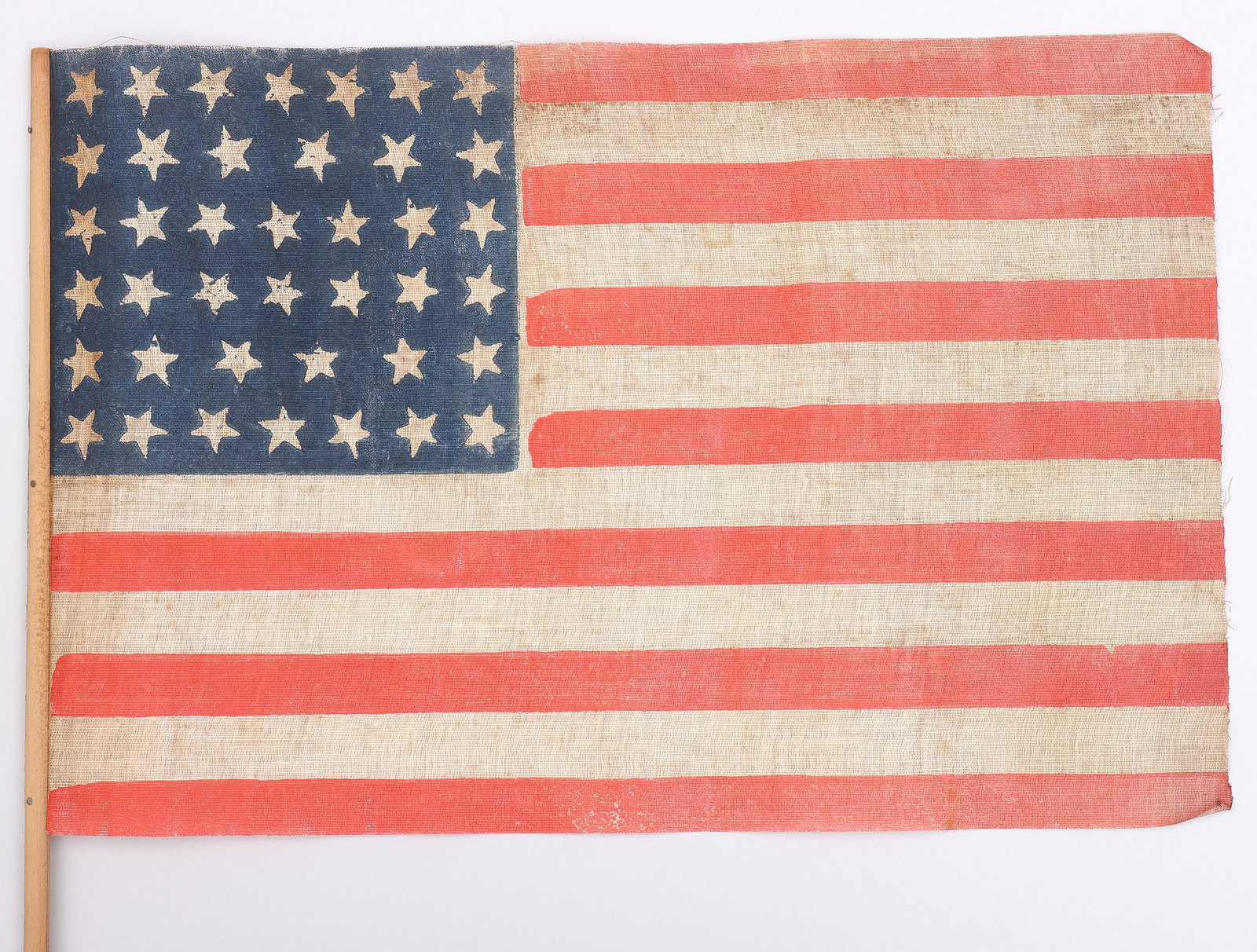 40-Star American Parade Flag, 1889: 40-Star American Parade Flag, 1889 printed glazed cotton muslin with wood staff. Provenance: Acquired by descent from Dr. George R. Brush, of the settling Brush family of Southold, Long Island, New Yo