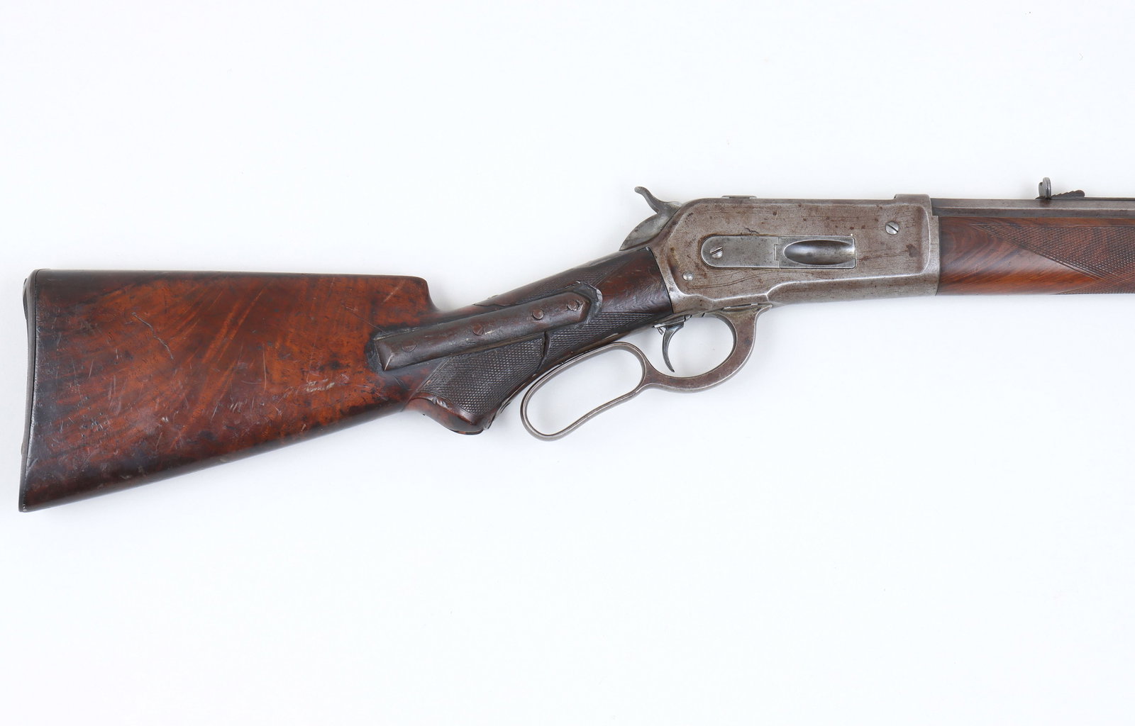 Winchester Model 1886 Deluxe in 40-82 WCF: Winchester Model 1886 Deluxe in 40-82 WCF The octagon barrel measures 26" with full-length magazine tube and adjustable trigger. The rifling is visible but rough with surface oxidation. The delux