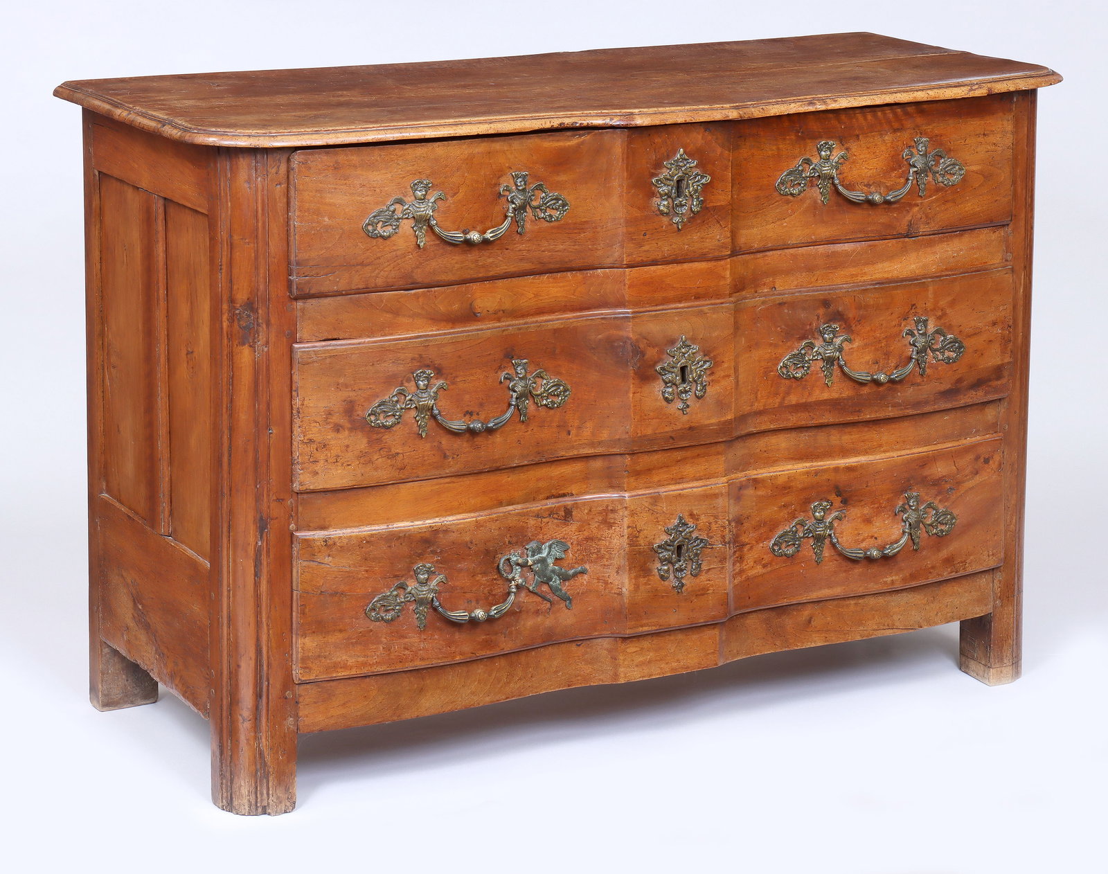18th Century Continental Walnut Commode: 18th Century Continental Walnut Commode having shaped top over a conforming case with three arc-en-arbalete shaped front drawers. Provenance: Property of a prominent Manhattan AD100 interior designer.