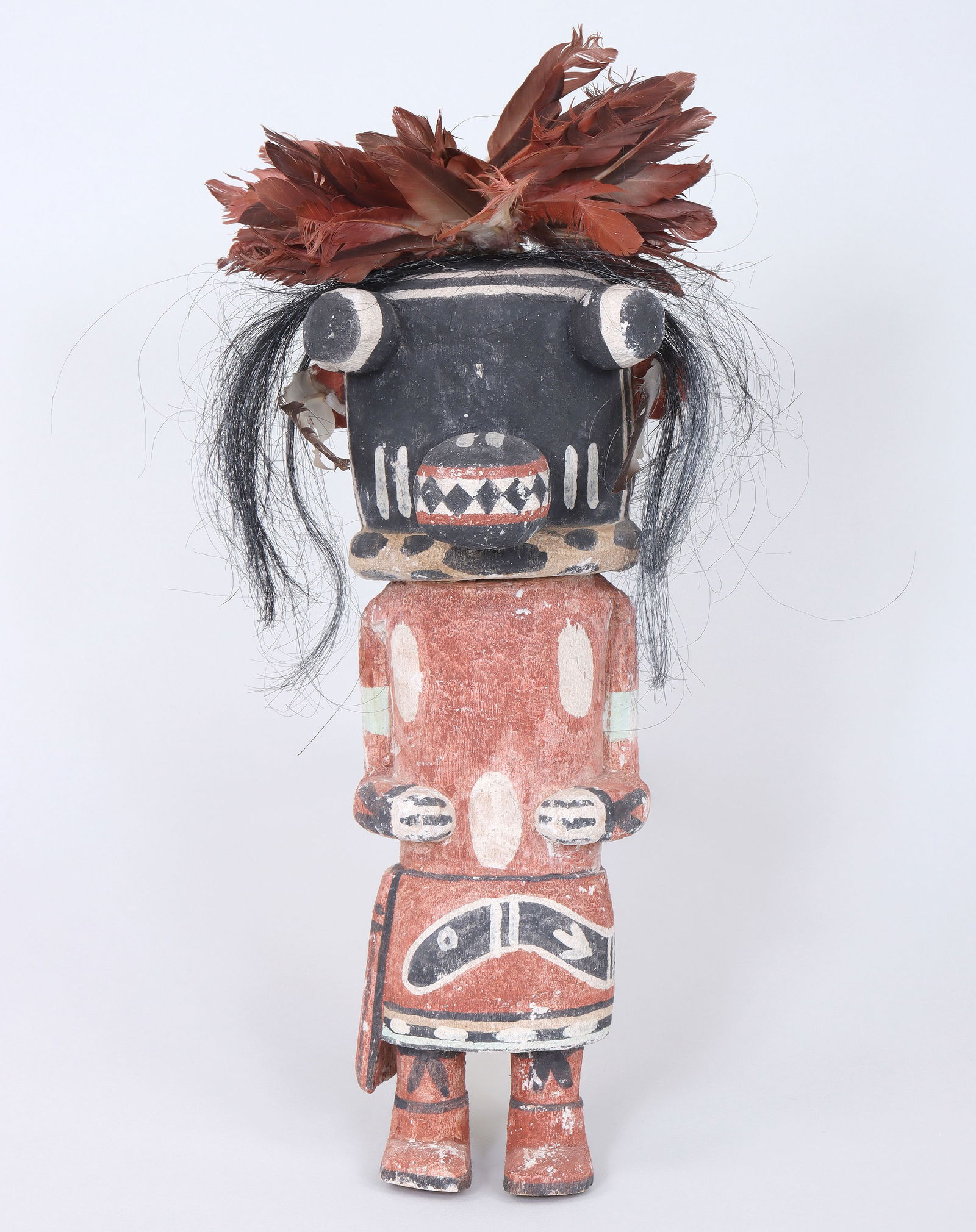 Manfred Susunkewa (Hopi b. 1940): Manfred SusunkewaHopi, b. 1940"Tsaveyo (Ogre)" Katsina Figurecarved wood, natural pigments, feathers, horse hairsigned and marked with "spider" cipher on bottom.11 x 5 x 5 in. (27.9 x 12.7 x 12.7 cm.)