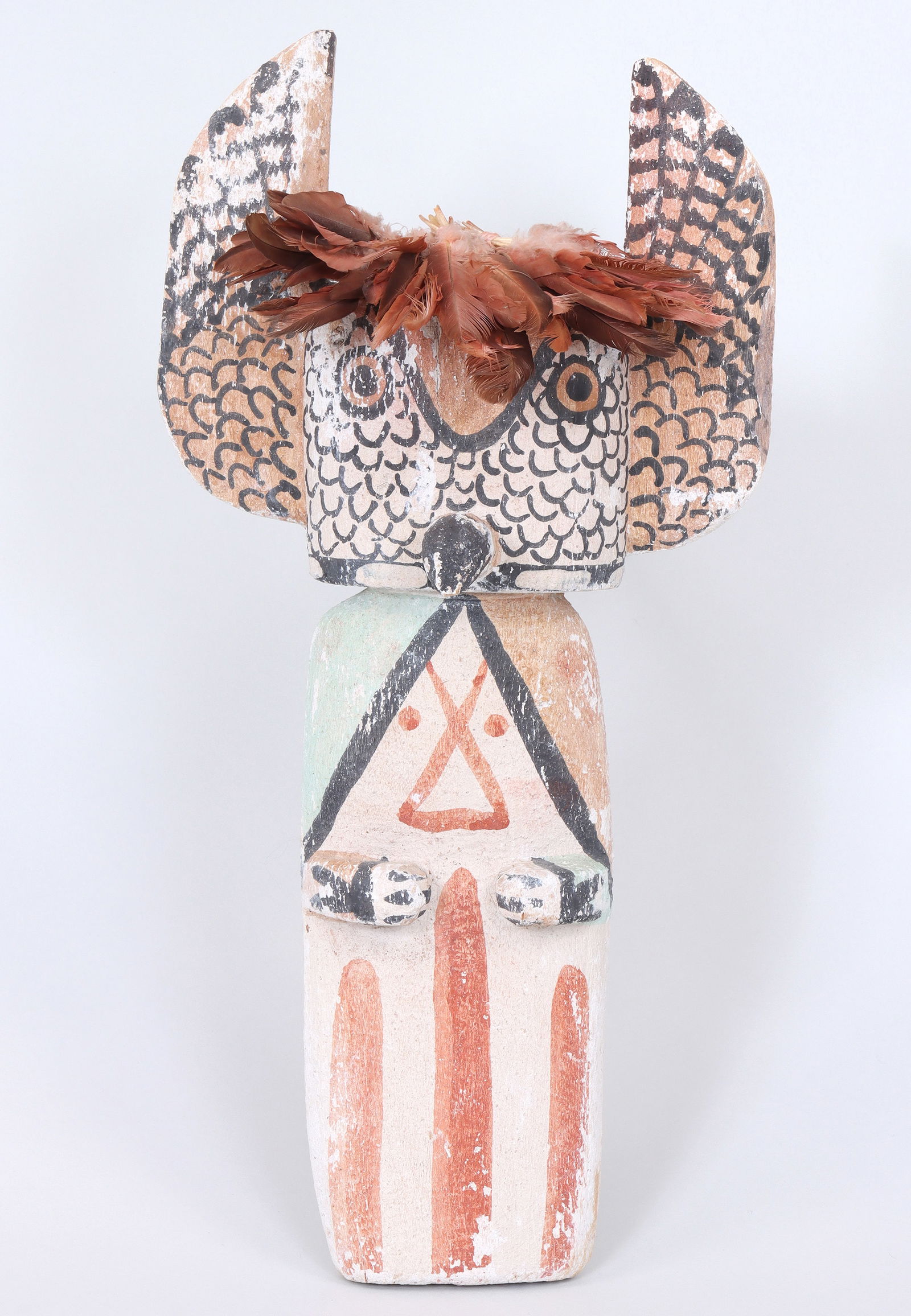 Attributed to Manfred Susunkewa (Hopi b. 1940): Attributed to Manfred SusunkewaHopi, b. 1940"Mongwa (Owl)" Katsina Carvingcarved wood, natural pigments, featherspartial signature on bottom.14 x 7 x 3 1/4 in. (35.6 x 17.8 x 8.3 cm.)