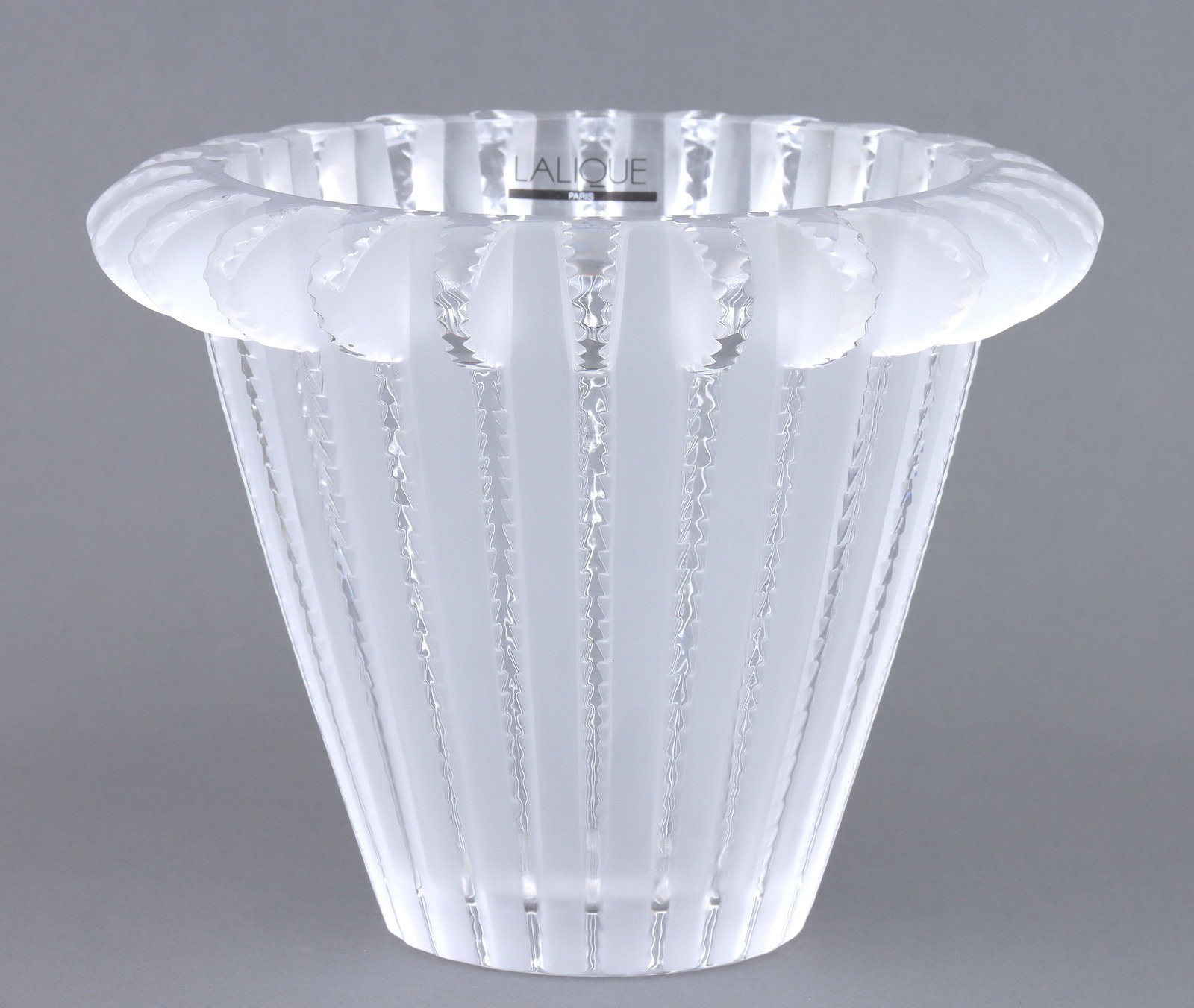 Lalique "Royat" Glass Vase: Lalique "Royat" Glass Vase the body of flaring cylindrical form, having ribbed exterior, the raised bands with notched edges and lobed tops creating a rounded outward rim, and the areas betw