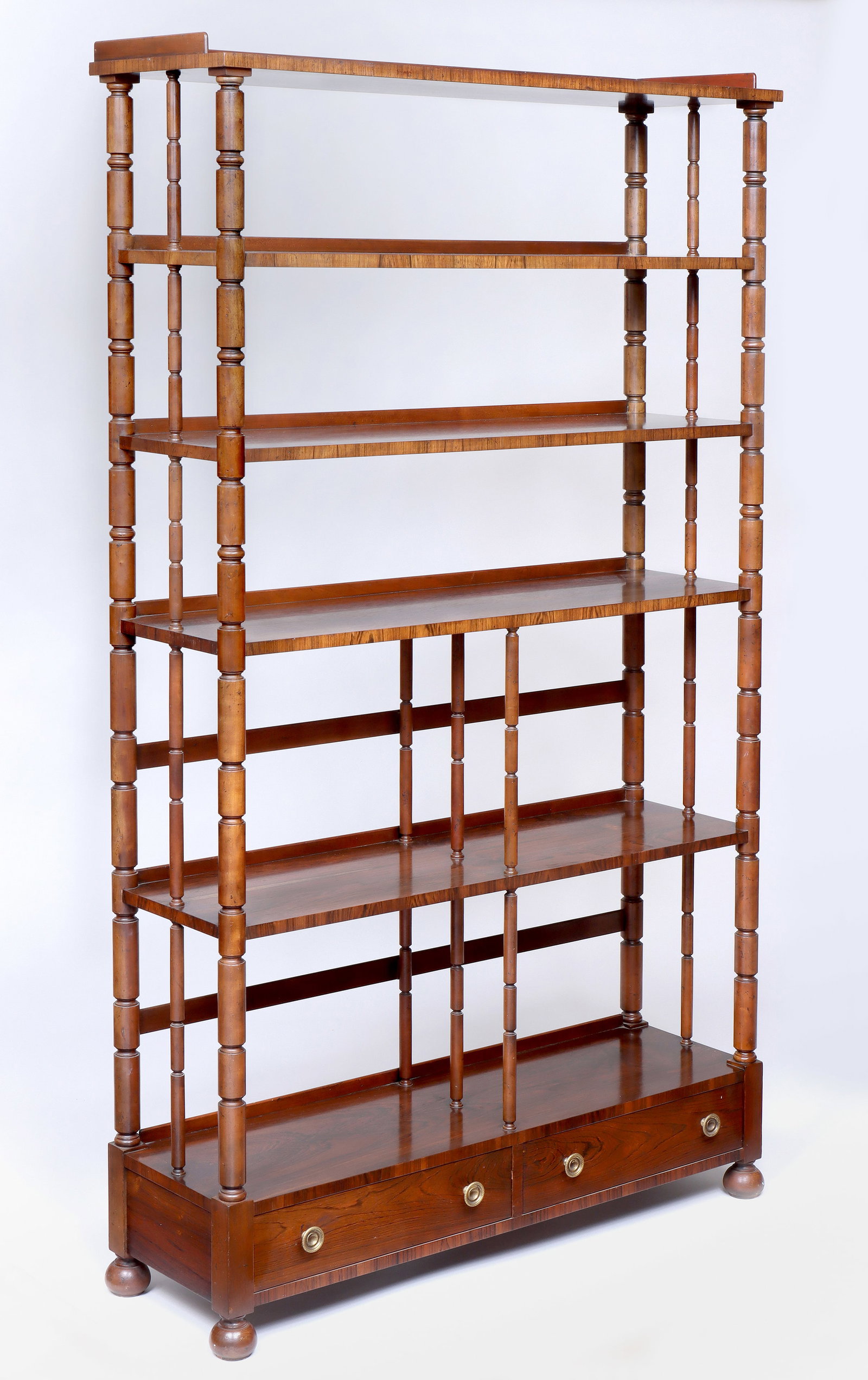 Rosewood Six-Shelf Etagere with Two Drawers: Rosewood Six-Shelf Etagere with Two Drawers having turned supports, the top shelf with three-quarter gallery, bottom two shelves with turned separators for support, above two short drawers, raised on 