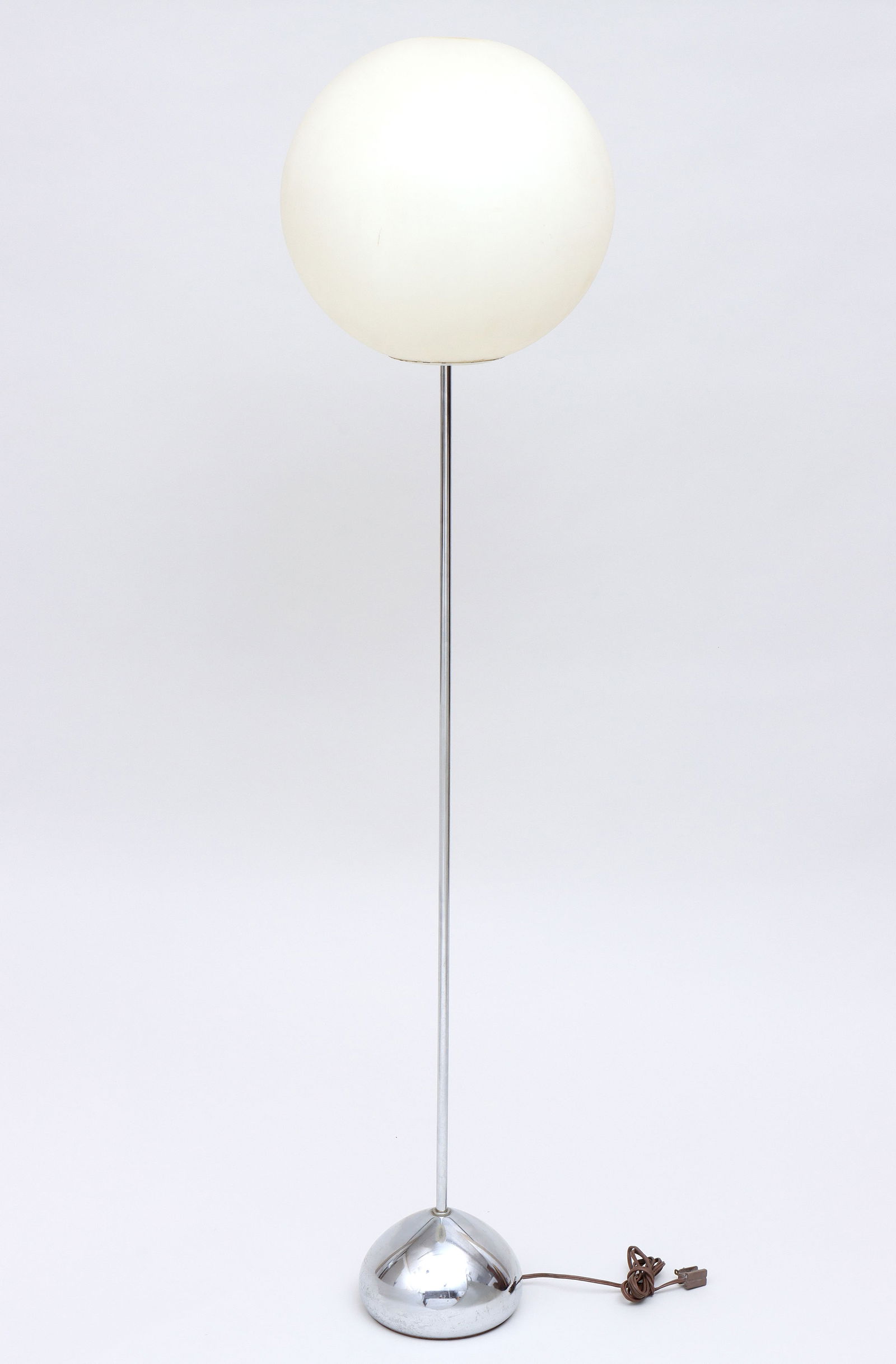 Robert Sonneman (American b. 1943): Robert SonnemanAmerican, b. 1943Globular Floor Lampwith chrome base and white diffusing plastic globe, foil label at socket.56 3/4 in. (144.1 cm.)