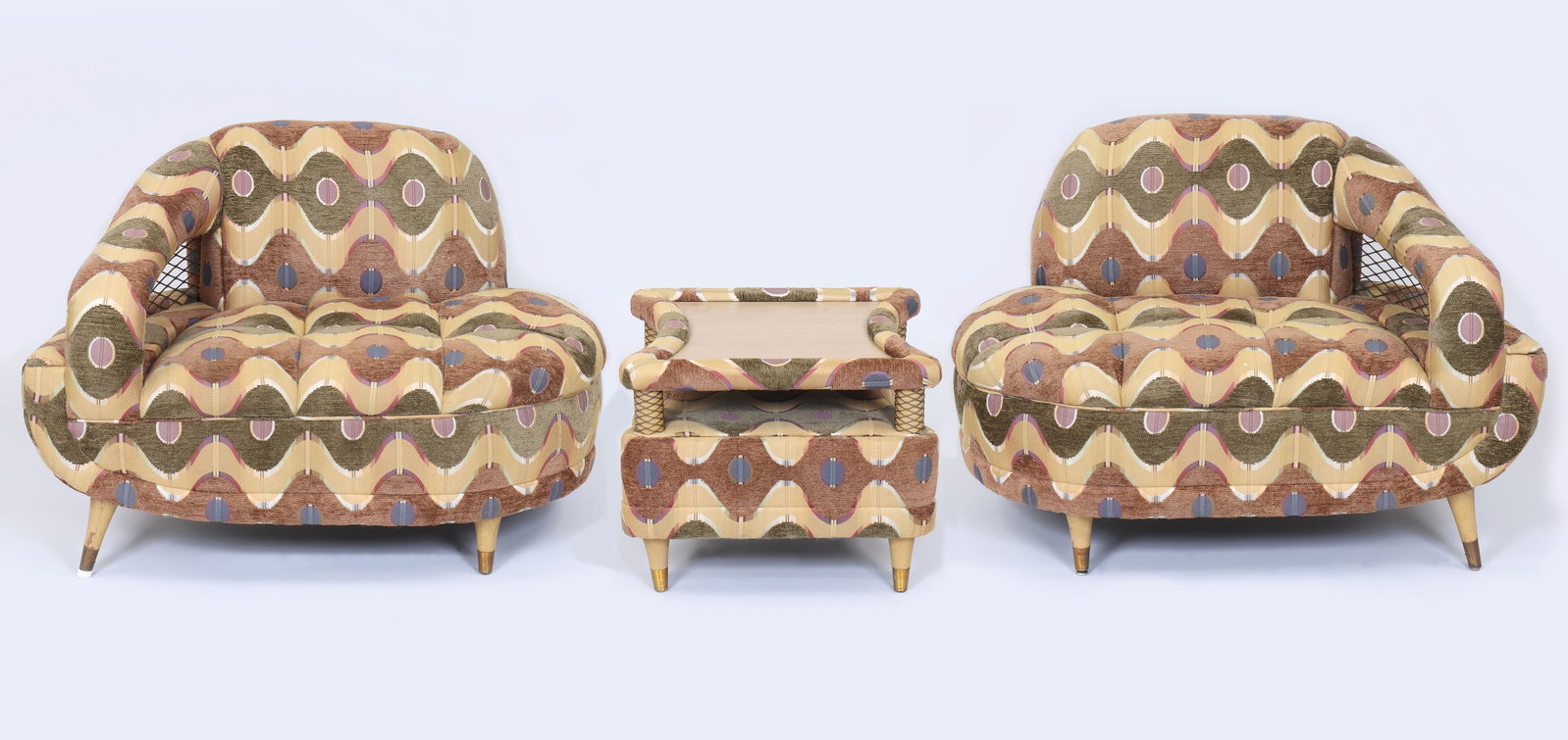 Midcentury Modern Three-Piece Suite: Midcentury Modern Three-Piece Suite having a pair of lounge chairs with armrest and brass screened opening, and a two-level table/ottoman with screen-wrapped supports. Chairs 29 x 41 x 32 in. (73.7 x 
