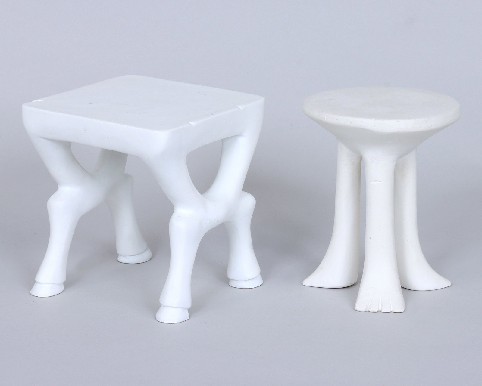 John Dickinson (American 1920-1982): John DickinsonAmerican, 1920-1982for SutherlandSet of (2) Miniature Plaster Furnitureto include: "African Table", marked on stickers adhered to bottom; and "Hoofed Table", unmarked