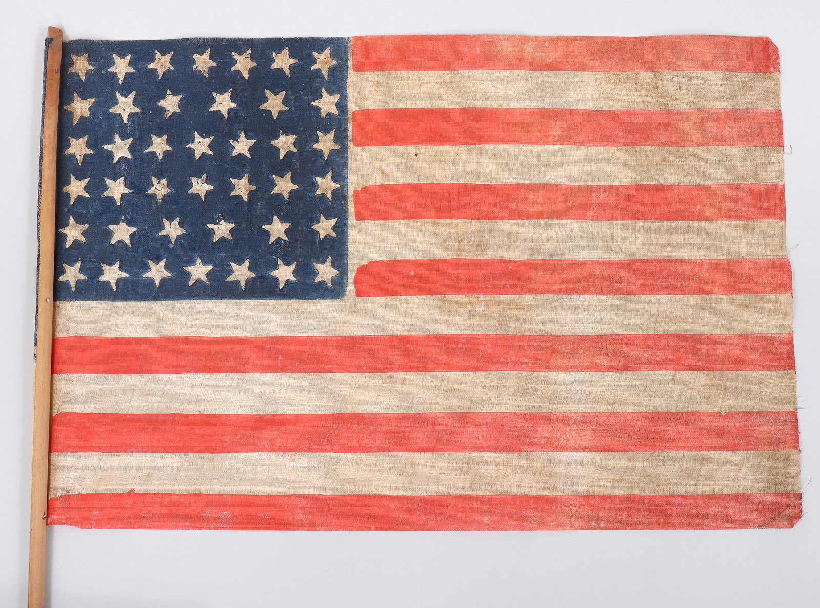 40-Star American Parade Flag, 1889: 40-Star American Parade Flag, 1889 printed glazed cotton muslin with wood staff. Provenance: Acquired by descent from Dr. George R. Brush, of the settling Brush family of Southold, Long Island, New Yo