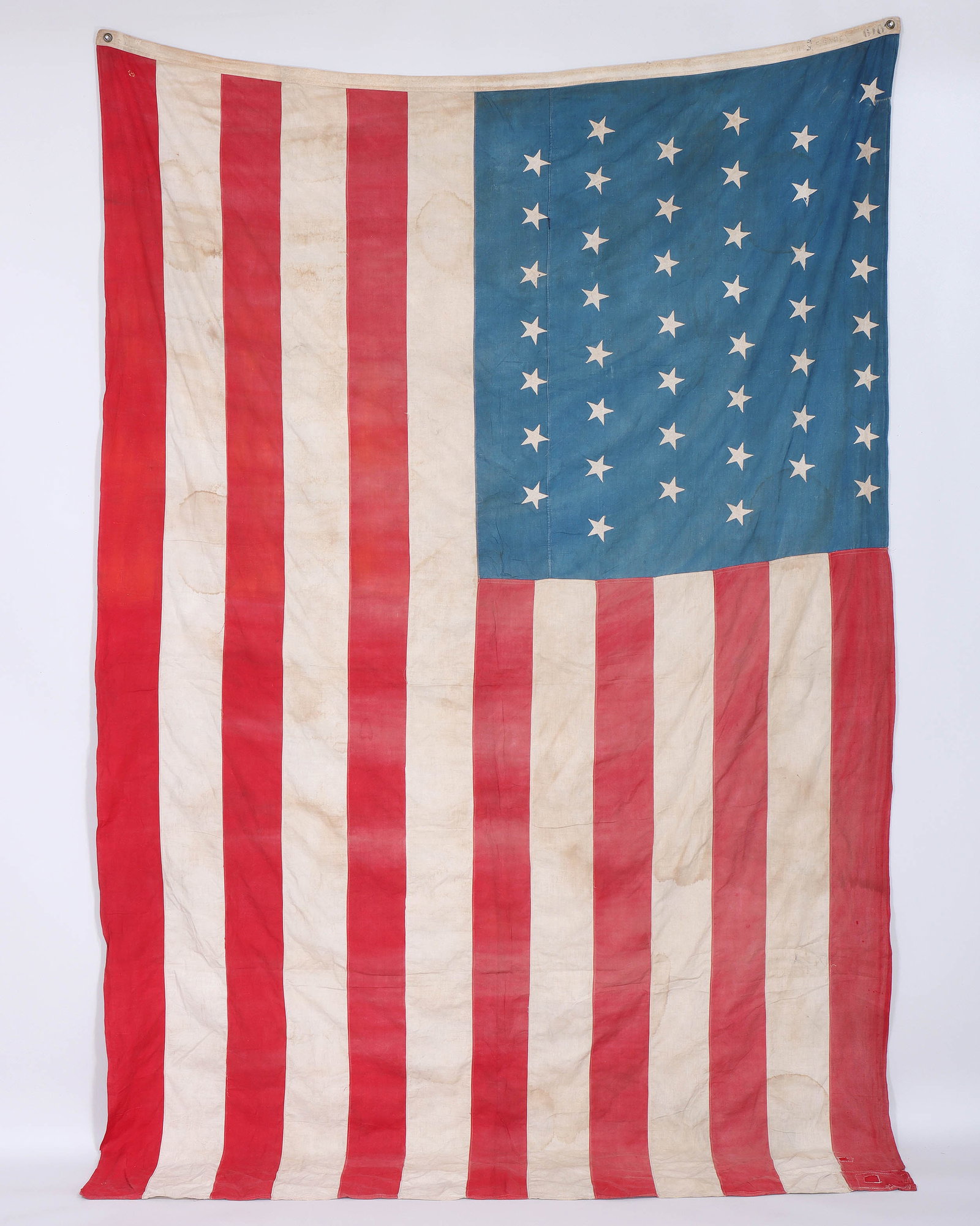 45-Star American Flag, Spanish-American War, 1896-1907: 45-Star American Flag, Spanish-American War, 1896-1907 sewn cotton flag, with the canton in a 8-7-8-7-8-7 pattern, the hoist stenciled "Fred S. Sabey" followed by "6 ft", with the 