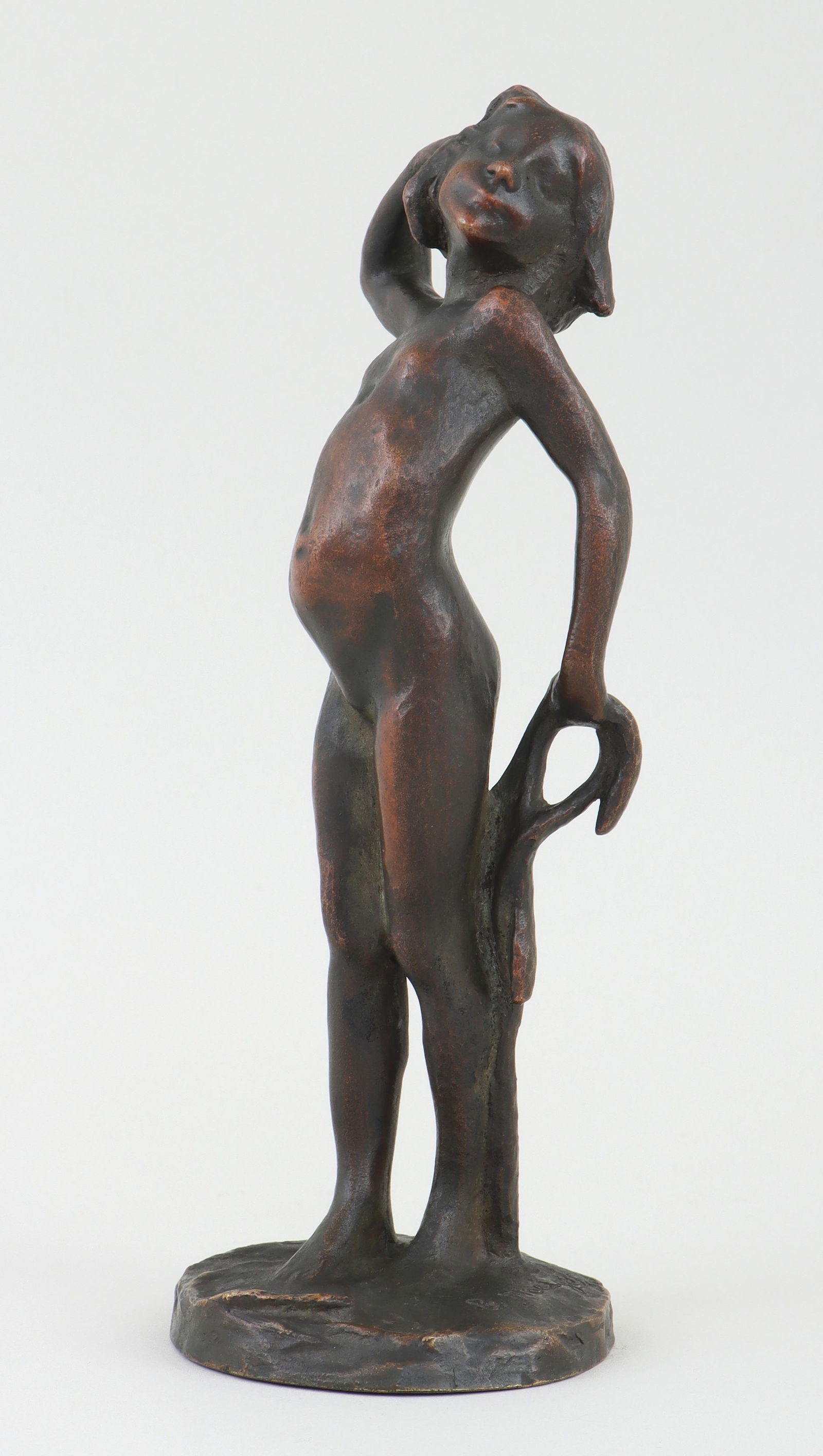 Bernhard Hoetger (German 1874-1949), Girl with Ribbon, bronze with light brown and green patina: Bernhard HoetgerGerman, 1874-1949Girl with Ribbonbronze with light brown and green patinasigned on base.8-1/4"h
