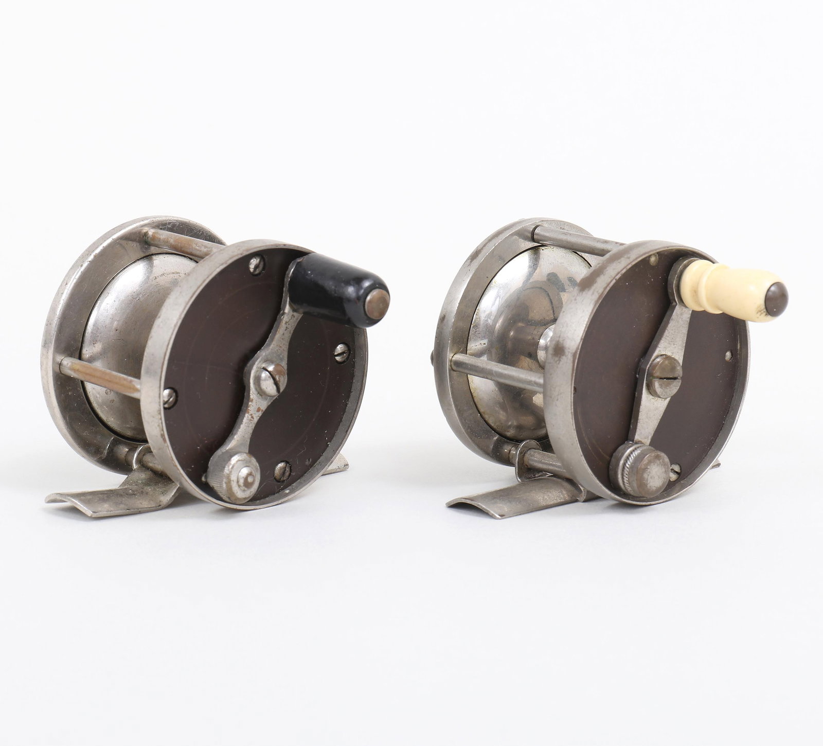 Group of (2) Fly Reels: Group of (2) Fly Reelsto include: 1) Forhan?s reel marked, 2? diameter, and marked "40" on foot. The bone handle is counterbalanced. There are no cracks in the hard rubber plates and the met