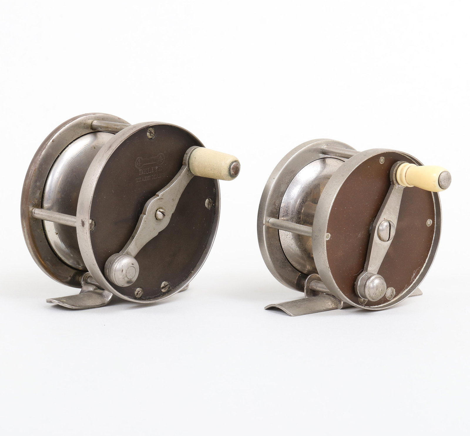 Group of (2) Fly Reels: Group of (2) Fly Reels to include: 1) Four Brothers "Delite" reel numbered "80" on foot with 2-1/2" diameter. The maker's name is still very visible on the face plate. The han