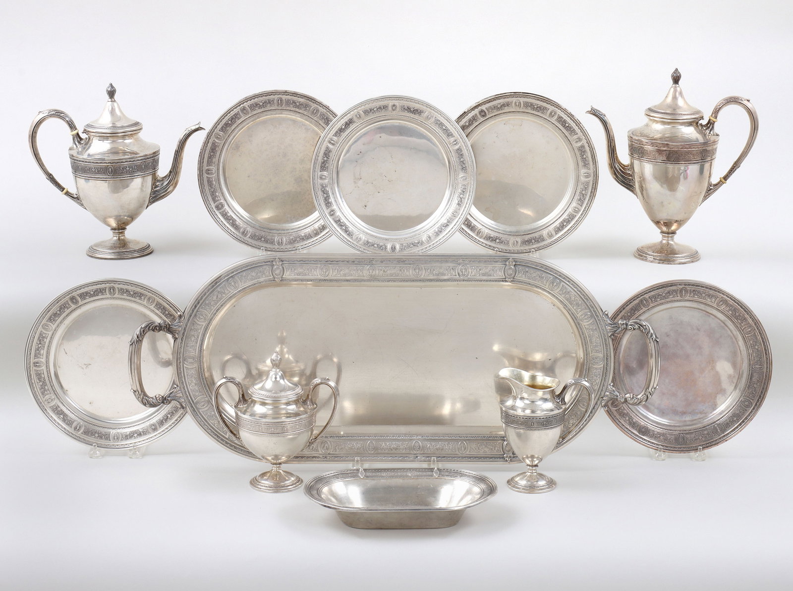 Large American Sterling Silver Eleven-Piece Tea Set: Large American Sterling Silver Eleven-Piece Tea Set in the Wedgwood pattern, International Silver Co., Meriden, CT, to include: teapot; coffeepot; covered sugar; creamer; large two-handled oval servin