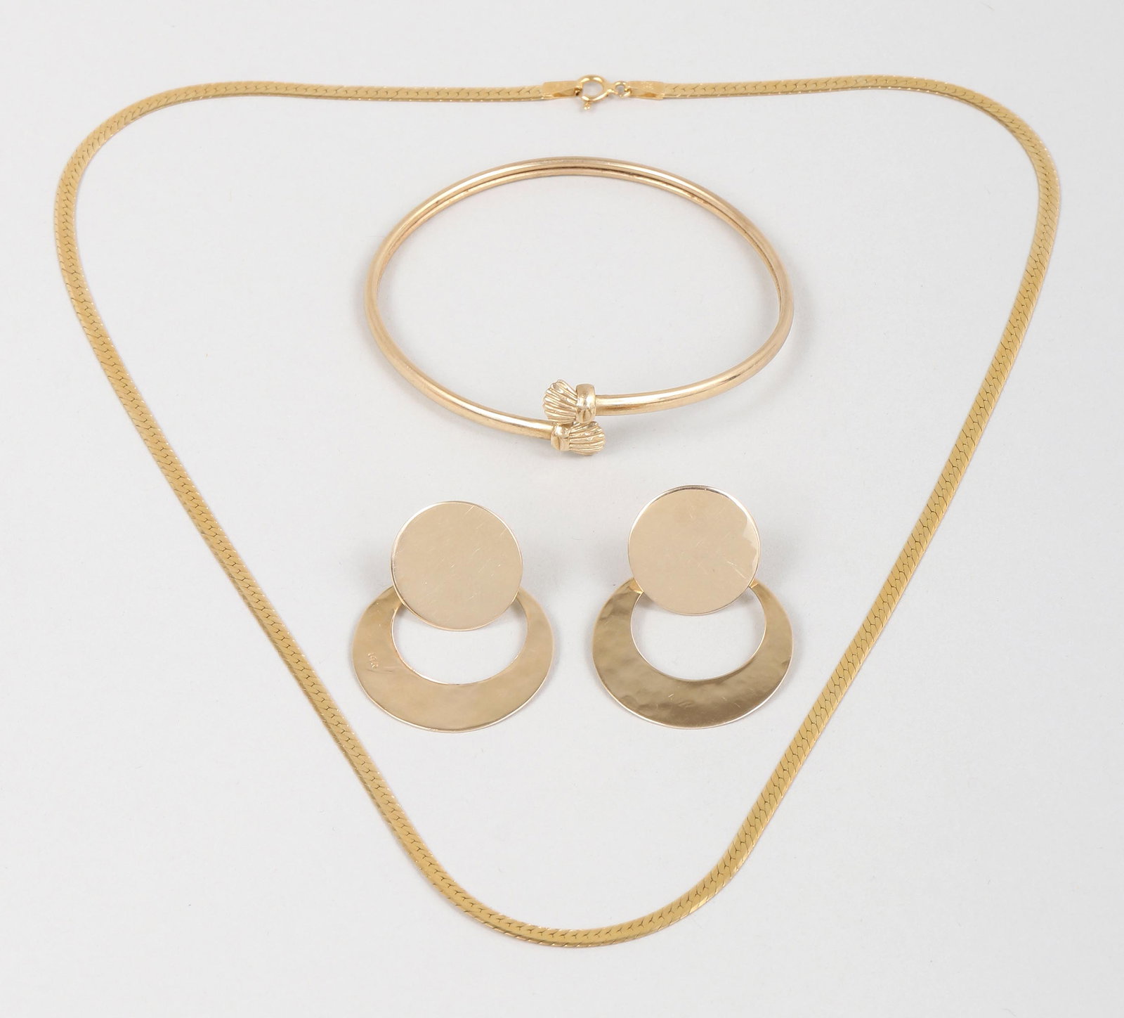 Group of (3) 14k Gold Jewelry: Group of (3) 14k Gold Jewelry to include: herringbone chain necklace, Italy; bangle with shell-form ends; and pair of earrings, having large, round disc-form studs and hoop-form drops attached to earr
