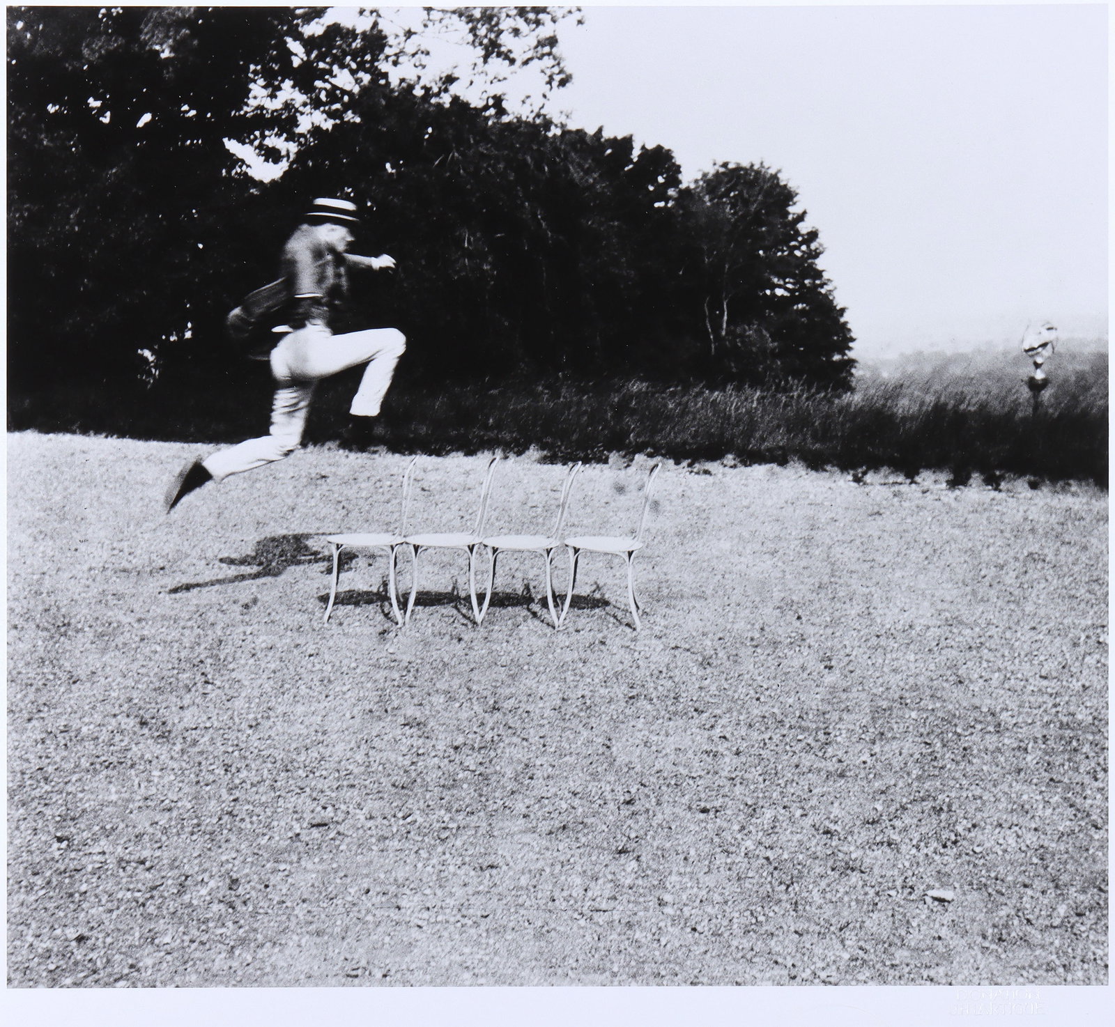 Jacques-Henri Lartigue (French 1894-1986), "Oleo Van Weers, Champion de Chaises, Rouzat", 1908,: Jacques-Henri LartigueFrench, 1894-1986"Oleo Van Weers, notre Champion du Saut de Chaises, Rouzat", 1908, printed 1998gelatin silver printStaley-Wise Gallery label adhered to frame verso, th