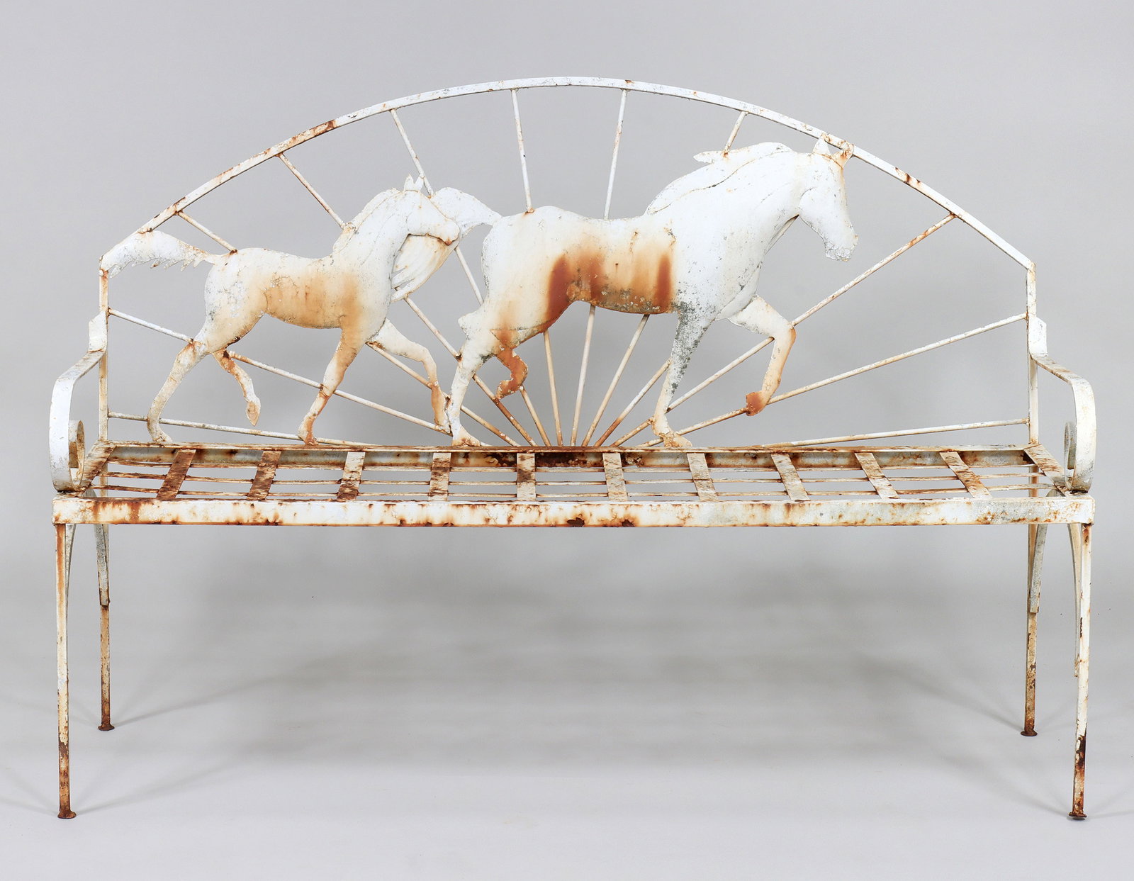 Running Horses Wrought Iron Settee: Running Horses Wrought Iron Setteehaving arched top rail and sunburst back rest with applied molded sheet iron horses, scrolled arms and iron strapwork seat.39 x 56 1/2 x 22 in. (99.1 x 143.5 x 55.9 c