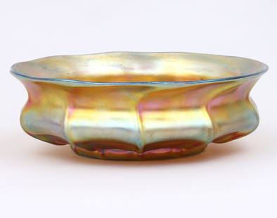 Tiffany Large Favrile Glass Bowl: Tiffany Large Favrile Glass Bowlof ribbed circular form, with flared rim, signed "L.C.T. Favrile" and numbered "3376" on bottom.3 1/2 in. x 10 3/8 in. dia. (8.9 cm. x 26.4 cm. dia.