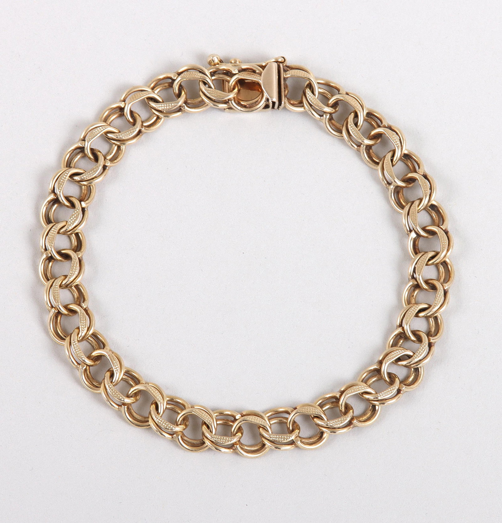 14k Gold Parallel Chain Braclet: 14k Gold Parallel Chain Braclet with textured links, marked on clasp. Length (open) 7 1/2 in. (19.1 cm.); approximate weight 7.9 dwt.