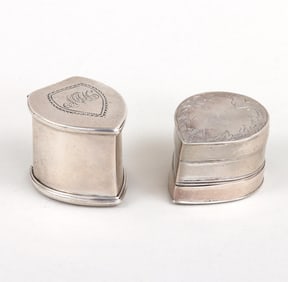 Group of (2) teardrop-form silver nutmeg graters.
