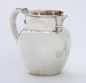 A handsome coin silver water pitcher, unmarked, circa 1810.