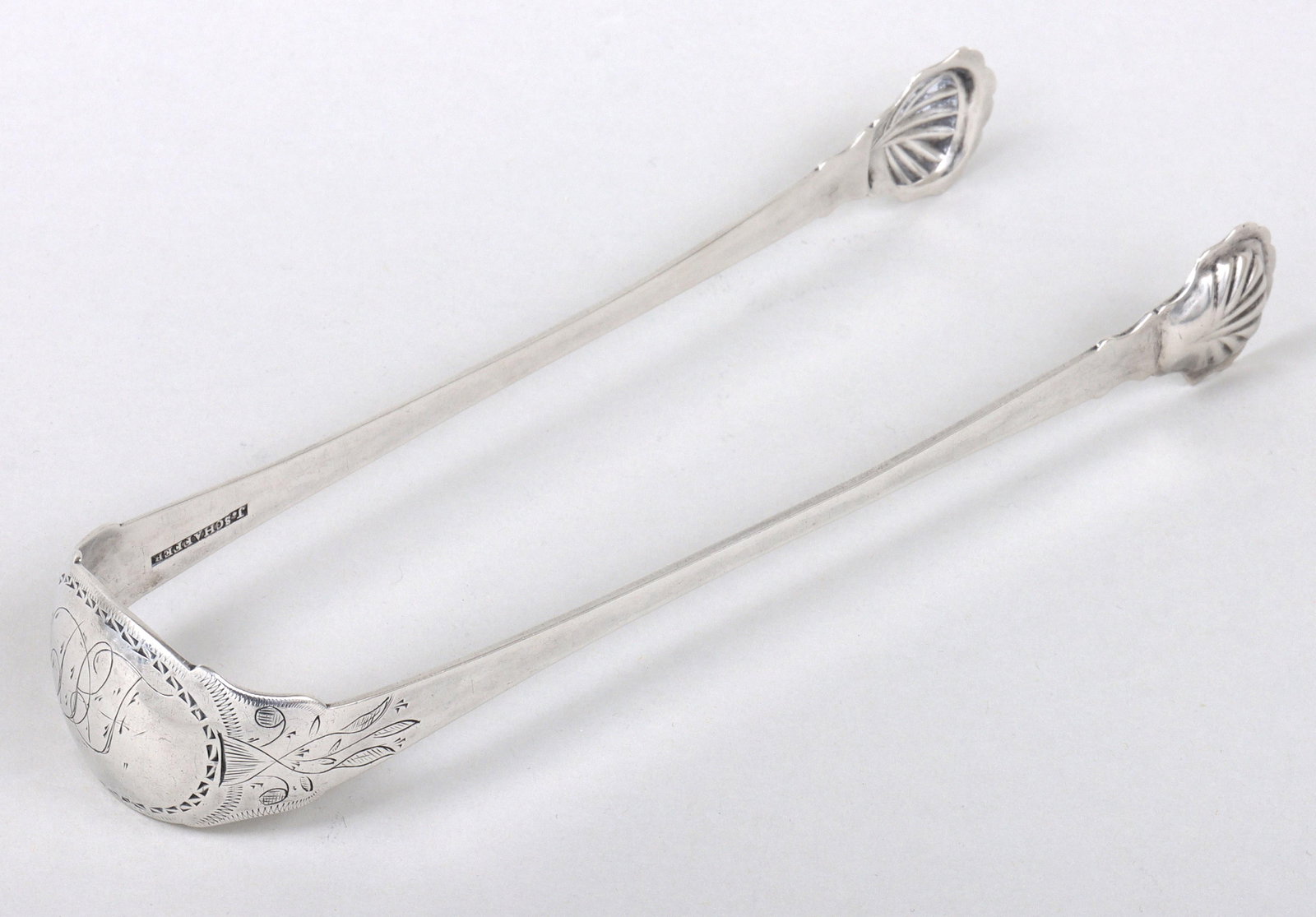 Rare early 19th century sugar tongs, Jacob Schaffer, Washington, PA.: Rare early 19th century sugar tongs, Jacob Schaffer, Washington, PA. Extra long shaped arms ending in oversized shell form ends. Wide concave bow engraved with bright-cut oval cartouche and trailing v