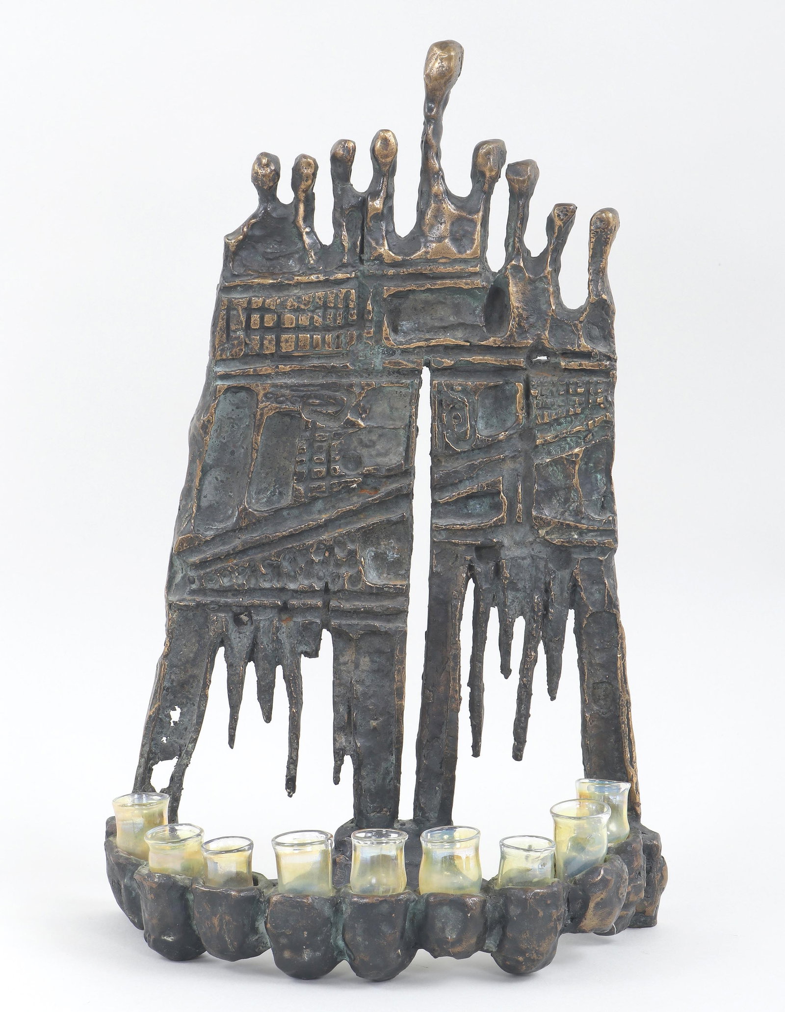 Aharon Bezalel (Afghani/Israeli 1926-2012), Brutalist Menorah, bronze: Aharon Bezalel Afghani/Israeli, 1926-2012 Brutalist Menorah bronze with handblown glass candleholders, appears unsigned. 19 x 12 x 6 in. (48.3 x 30.5 x 15.2 cm.)