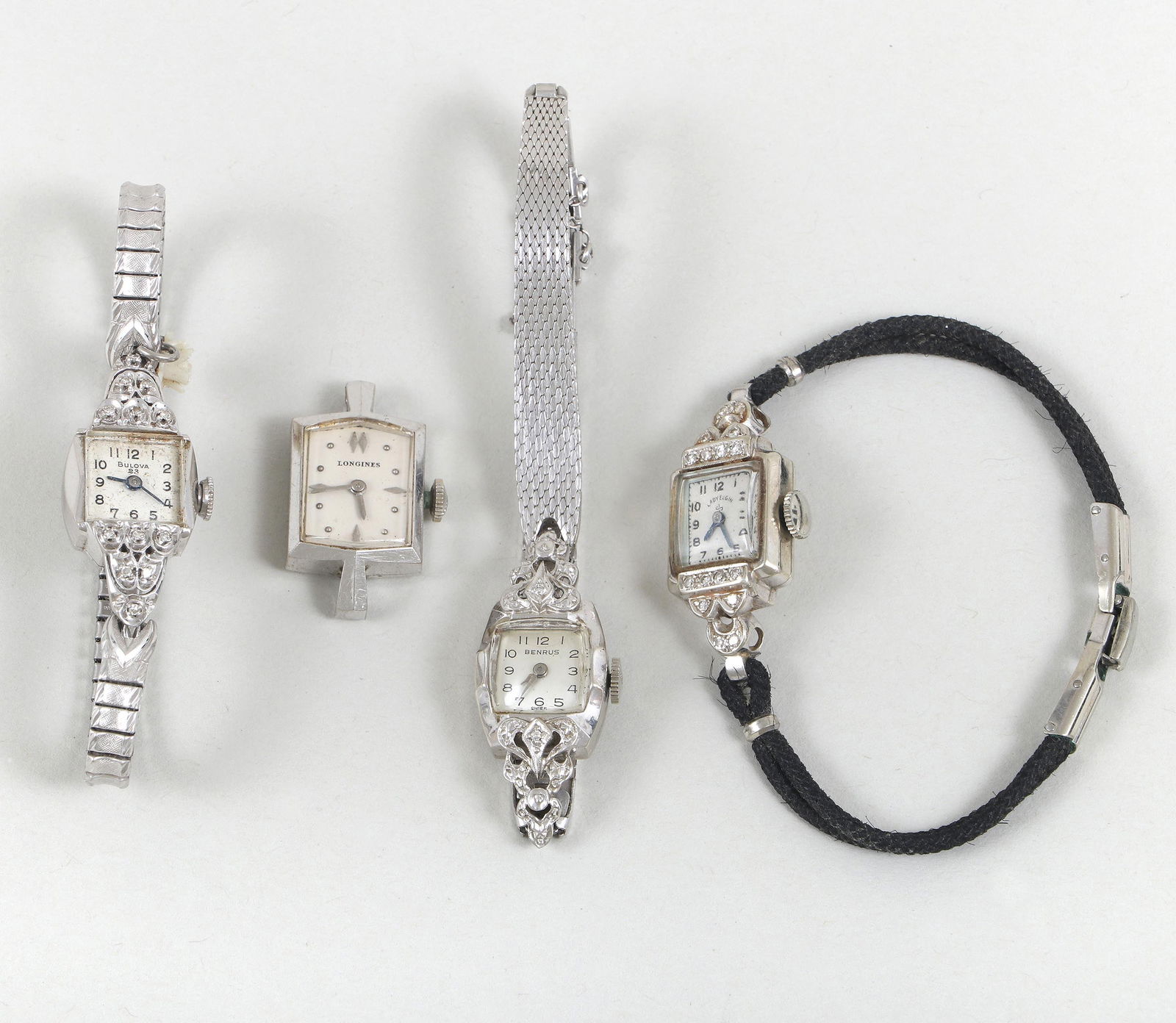 Group of (4) Ladies' Wristwatches in 14k White Gold Cases: Group of (4) Ladies' Wristwatches in 14k White Gold Casesto include: Bulova in case having scalloped ends with (12) round-cut diamonds, 23 jewels, case back numbered "656660", on gold-filled expandabl