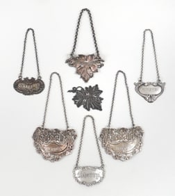 Group of (7) Silver Bottle Tickets or Decanter Labels