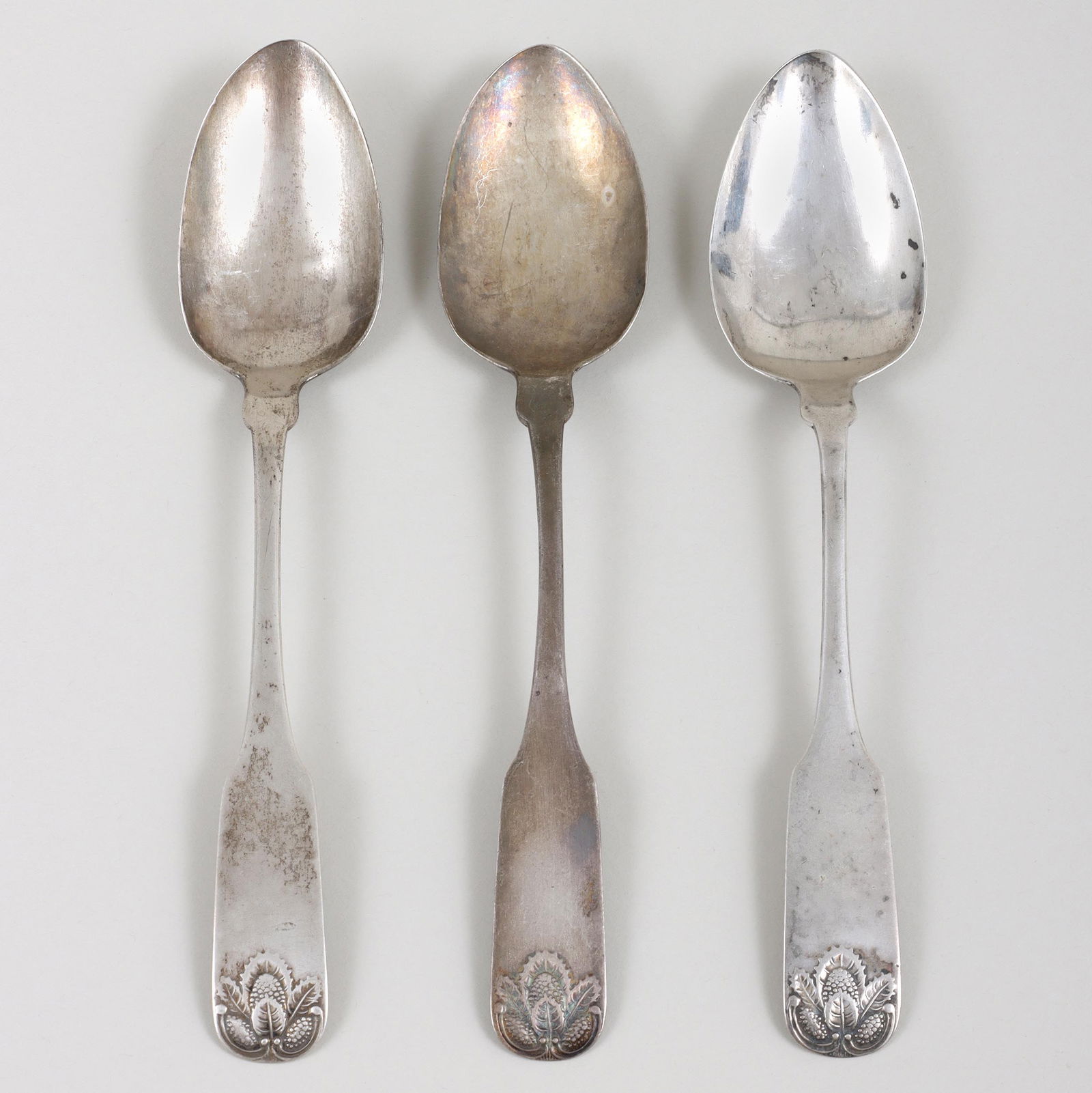 Set of (3) American Coin Silver Tablespoons, John Ewan, Charleston, SC, early 19th century: Set of (3) American Coin Silver TablespoonsJohn Ewan, Charleston, SC, early 19th centuryin fiddle form with mulberries, leaves and pair of C-scrolls in low relief on ends of handles, and having pictur