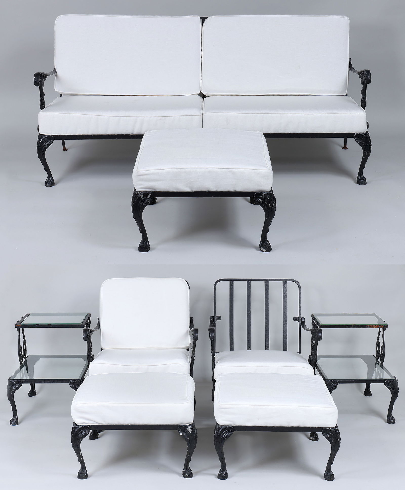 Eight-Piece Patio Set: Eight-Piece Patio Setiron and cast aluminum, having scrolled arms and supports, and cabriole legs ending on ball and claw feet, to include: sofa; pair of armchairs; (3) ottomans; and a pair of glass-t