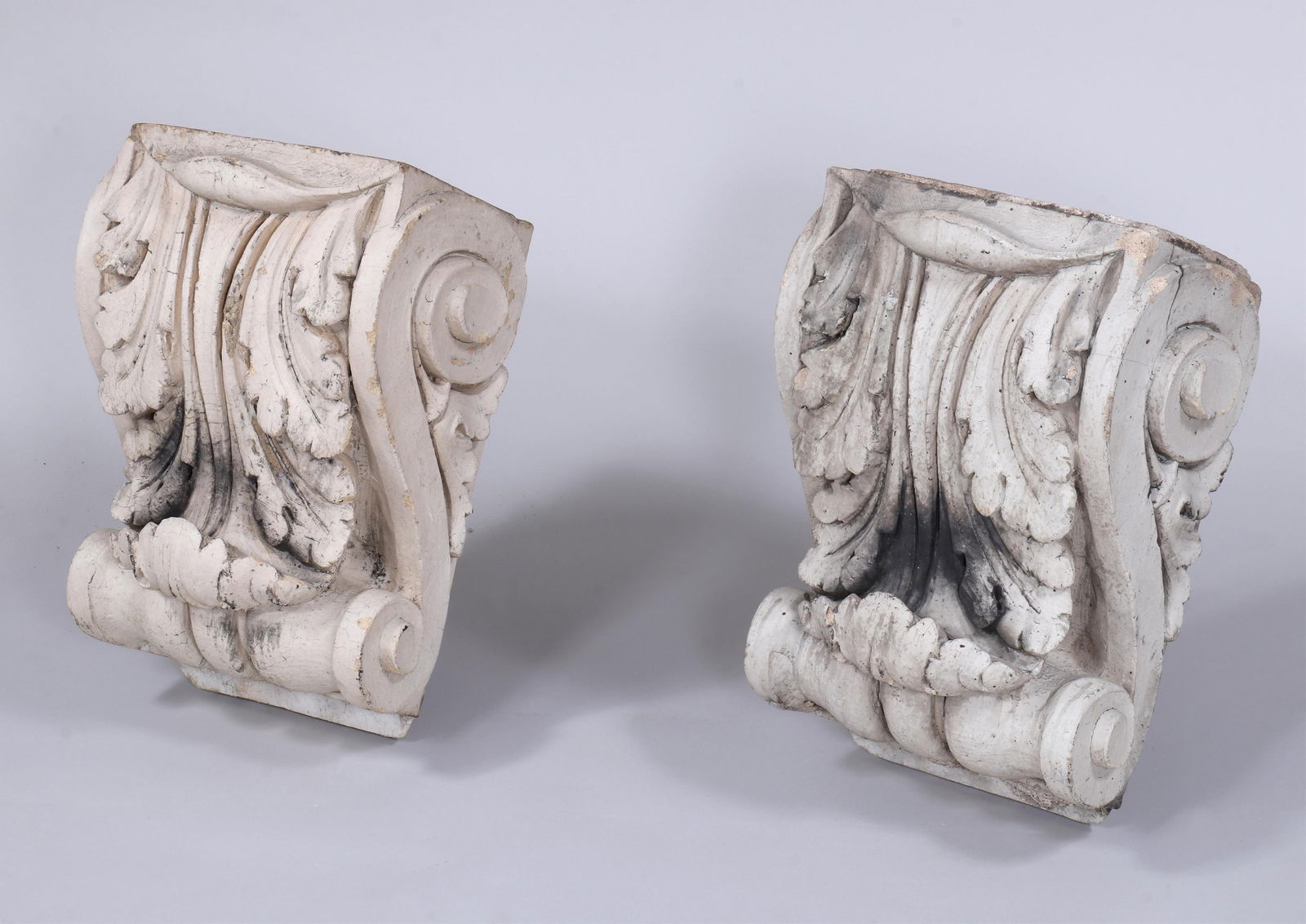 Pair of 19th Century New York City Cast Stone Corbels: Pair of 19th Century New York City Cast Stone Corbelsof S-scrolled form with acanthus leaf detail, from 110th street building.20 3/4 x 13 x 15 in. (52.7 x 33 x 38.1 cm.)