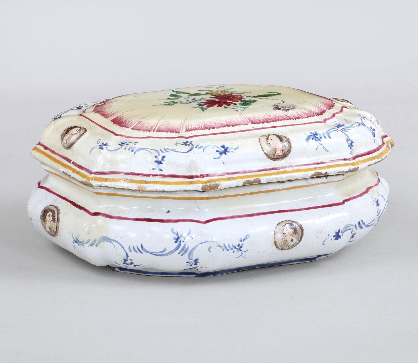 18th/19th Century Faience Box with Humorous Scene: 18th/19th Century Continental Faience Box with Humorous Scene Inside Lidof oblong form with scalloped edge and polychrome decoration, the exterior with floral decoration and portrait medallions or coi