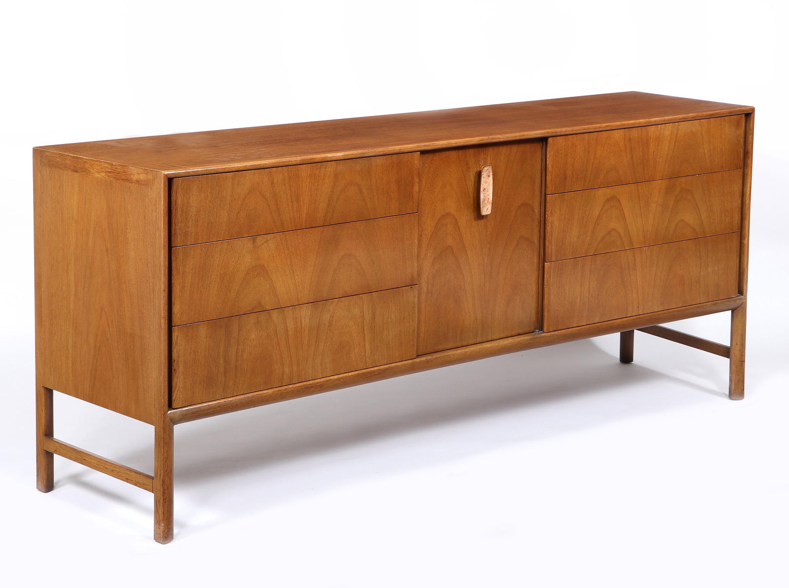 Raymond Sobota for John Stuart, Inc.: Raymond Sobota for John Stuart, Inc., Low Dresserhaving a central recessed door with enameled handle opening to three short drawers, flanked by three longer drawers on either side, in light mahogany.3