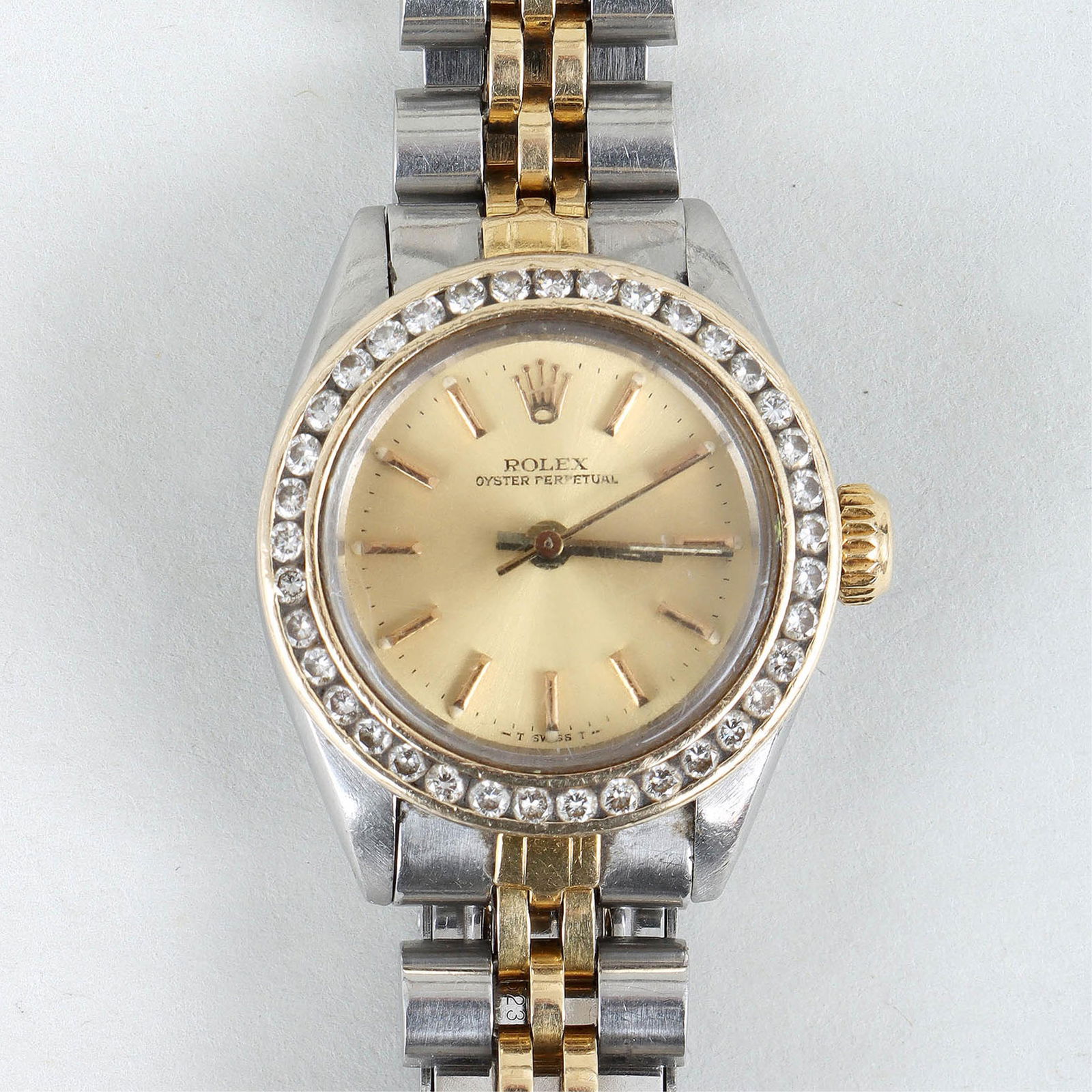 Rolex Oyster Perpetual Self-Winding Ladies' Wristwatch: Rolex Oyster Perpetual Self-Winding Ladies' Wristwatch with Interchangeable Gold Bezelshaving (2) interchangeable 14k gold bezels, one with (37) round-cut diamonds in a channel setting, the other a fl