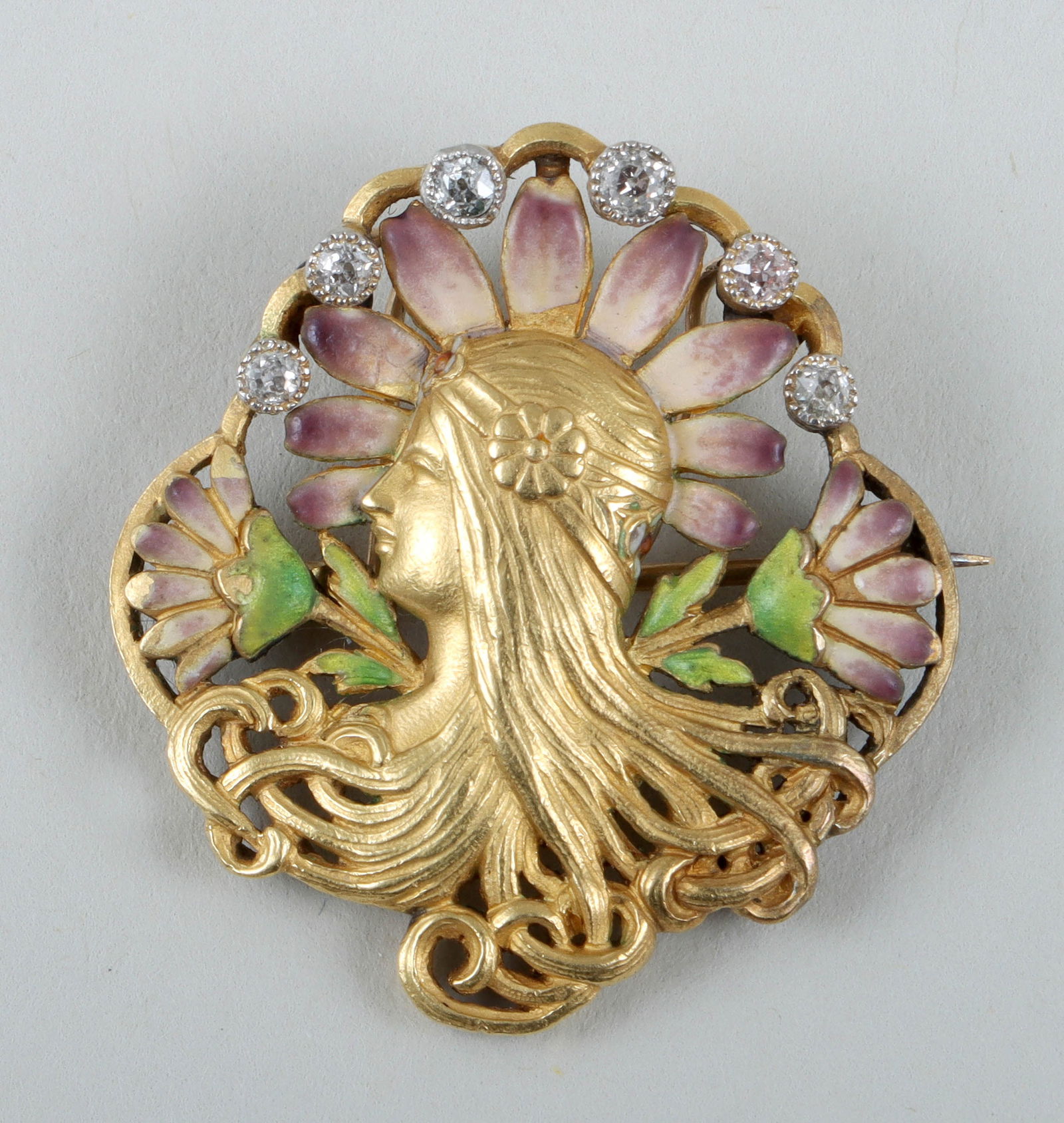Art Nouveau Enameled Gold and Diamond Pendant Brooch: Art Nouveau Enameled Gold and Diamond Pendant Broochthe pierced 18k yellow gold brooch depicting a woman in profile, surrounded by enameled flowers and a scalloped border having (6) round-cut diamonds
