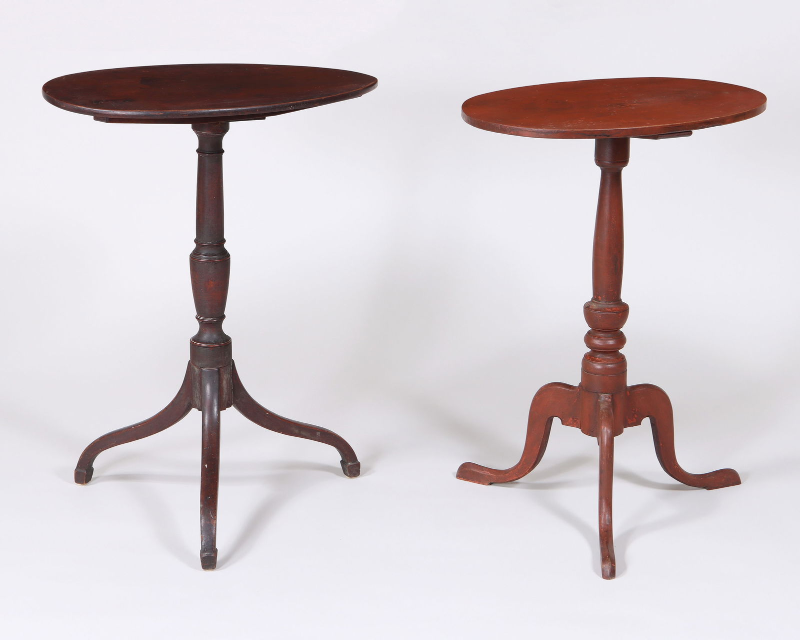Group of (2) Oval Top New England Candlestands: Group of (2) Oval Top New England Candlestandson turned standards with tripod legs, one ending in spade feet, the other with pad feet, 18th century.Taller stand 29 in. (73.7 cm.)