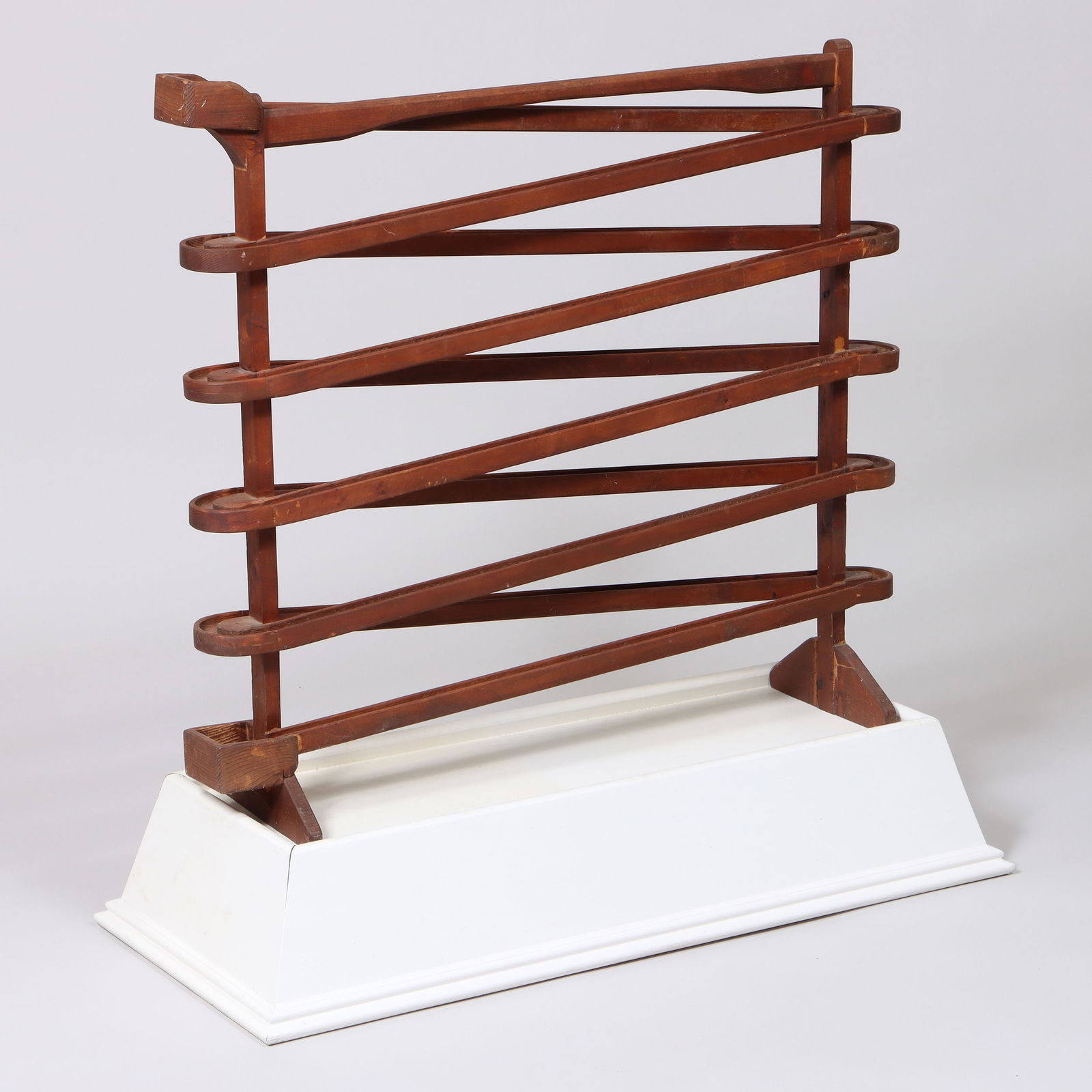 Large Wood Marble Run Toy: Large Wood Marble Run Toyalong with white-painted wood base of tapering rectangular form.Overall (including base) 36 3/4 x 36 1/2 x 16 1/8 in. (93.3 x 92.7 x 41 cm.), marble run only 30 3/4 x 34 1/4 x
