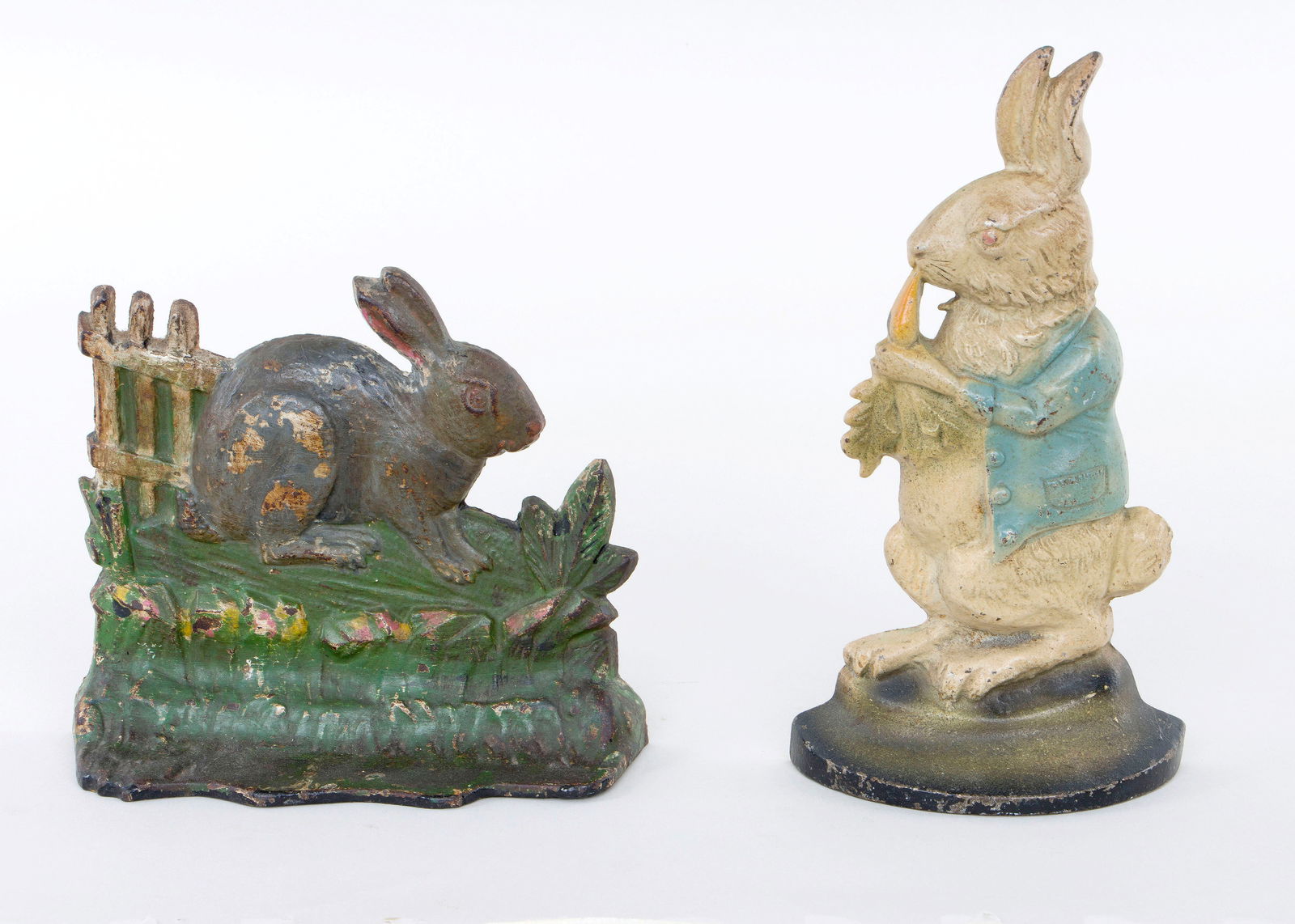 Group of (2) Rabbit Doorstops: Group of (2) Rabbit Doorstopspainted cast iron, to include: Albany Foundry "Rabbit by Fence", no. 59, marked and numbered on back, (small areas of craquelure, rabbit repainted or with primer visible);