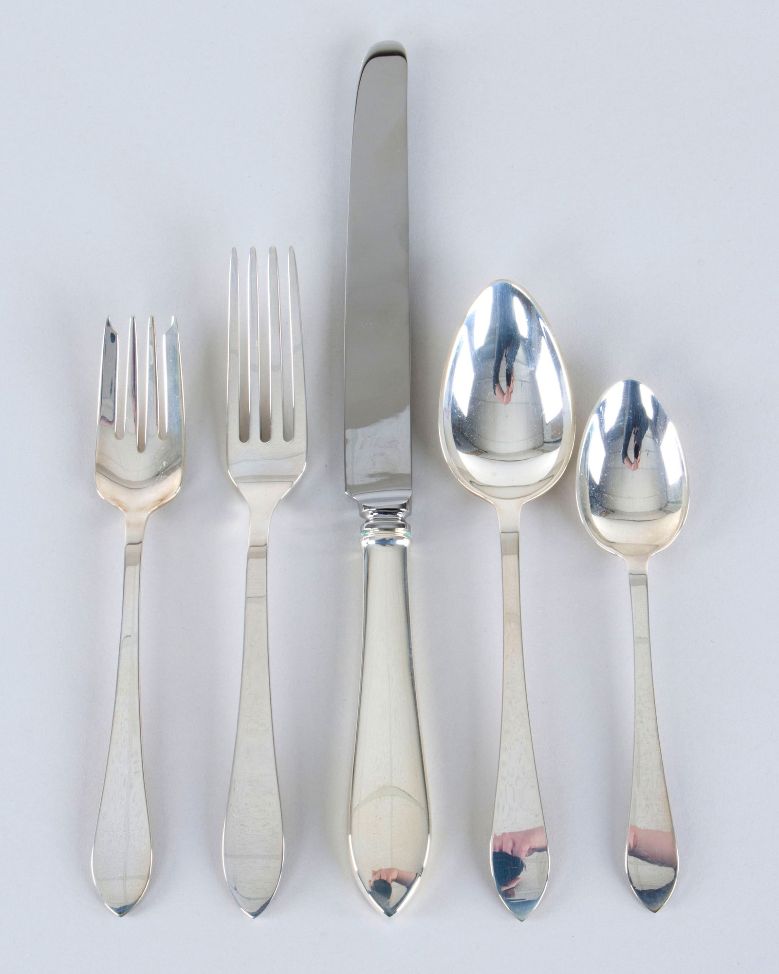 Tiffany & Co. Sterling Silver Flatware Service for Seven: Tiffany & Co. Sterling Silver Flatware Service for Sevenin the Faneuil pattern, in a setting of five, to include: (7) dinner forks; (7) sterling-handled dinner knives; (7) salad forks; (7) teaspoons;