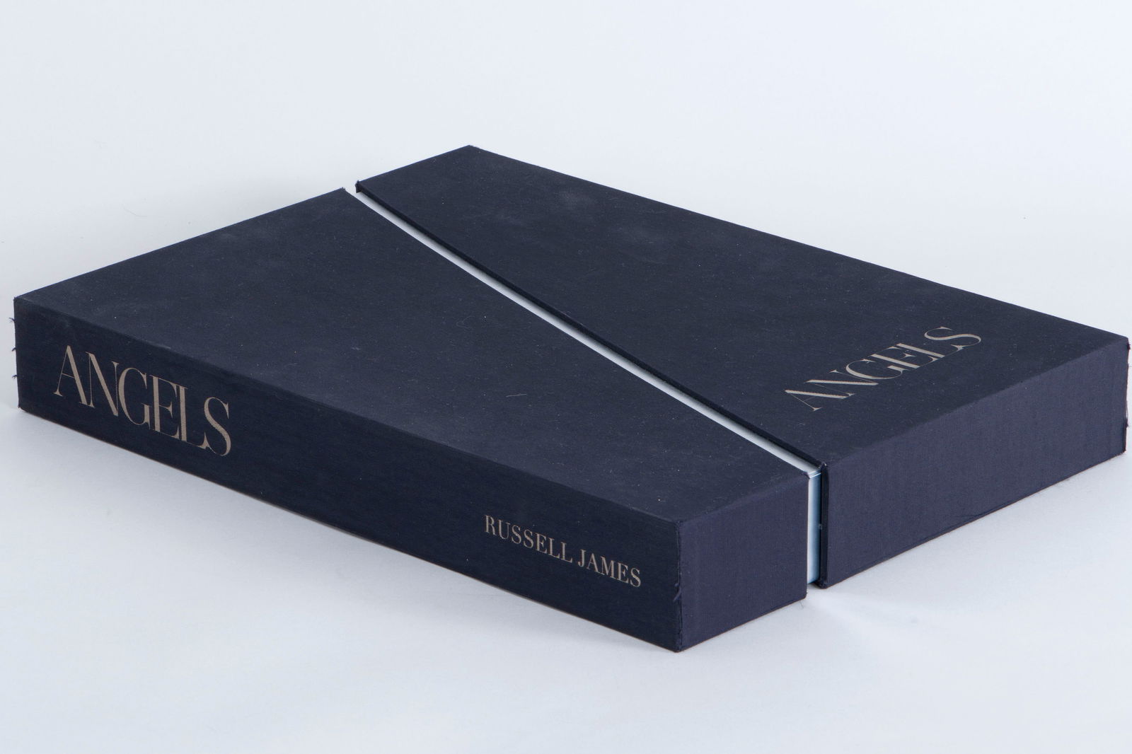 Russell James (Australian, b. 1962): Russell JamesAustralian, b. 1962"Angels"photobook"Collector's Edition", signed and numbered 645/1000, clothbound, in linen-wrapped slipcase, New York: 210 Publications LLC, 2018.
