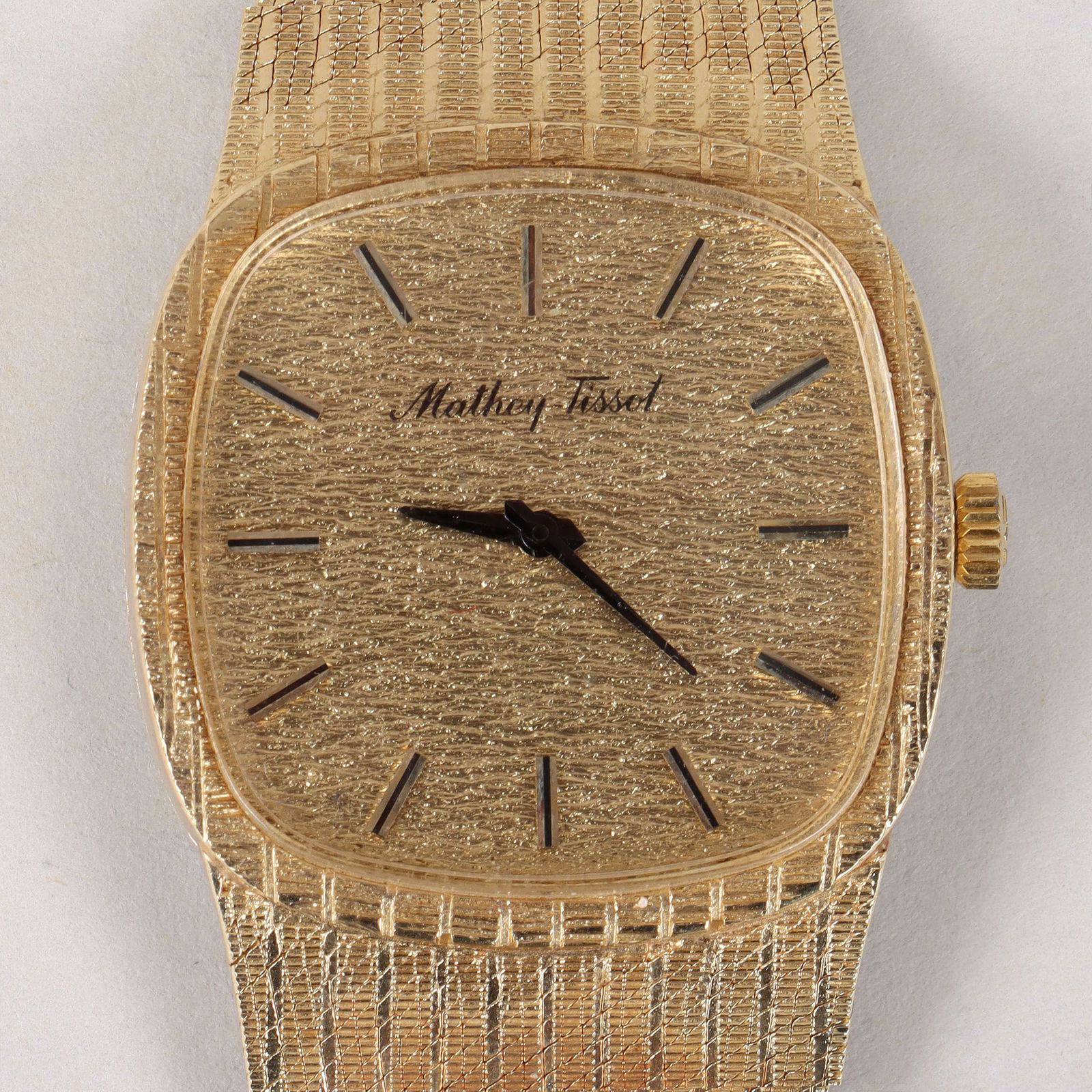 Mathey Tissot 14k Gold Men's Wristwatch: Mathey Tissot 14k Gold Men's Wristwatch17 jewels, serial no. 700429, having a goldtone cushion-form dial in a 14k gold case, on woven and textured 14k gold band, marked on movement, inside case, on ca
