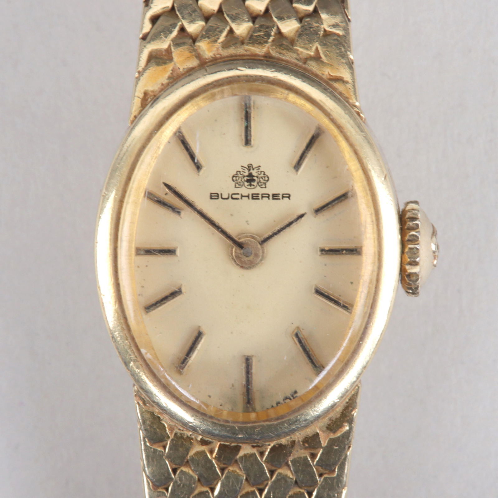 Bucherer 18k Gold Ladies' Wristwatch: Bucherer 18k Gold Ladies' Wristwatch17 jewels, serial no. 10150503, in 18k gold case, on 18k woven gold band, marked on movement, inside case, on case back, next to crown, and inside clasp; along with
