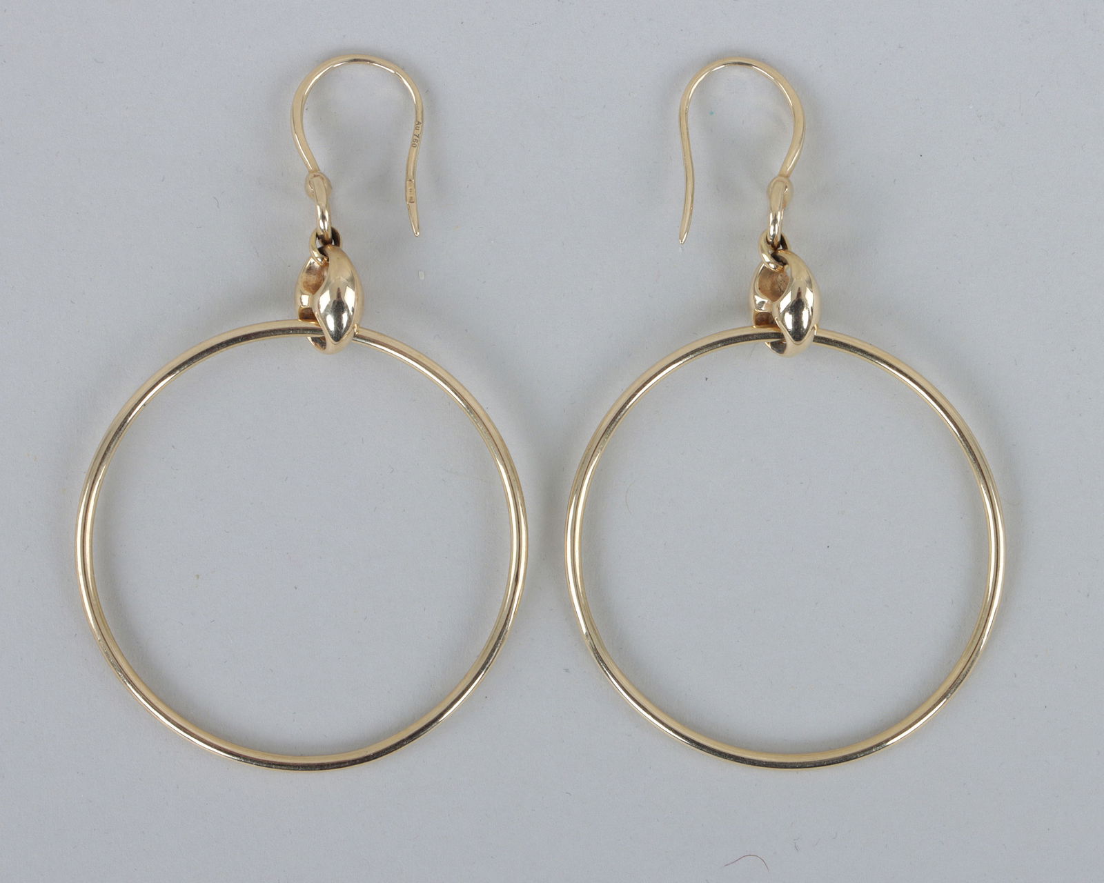Pair of Gucci 18k Gold "Marina Chain" Hoop Earrings: Pair of Gucci 18k Gold "Marina Chain" Hoop Earringseach having hook ending in a horsebit, a large "Marina"- or mariner-style chain link, and a large hoop, signed and marked on hooks.Diameter of hoop 1