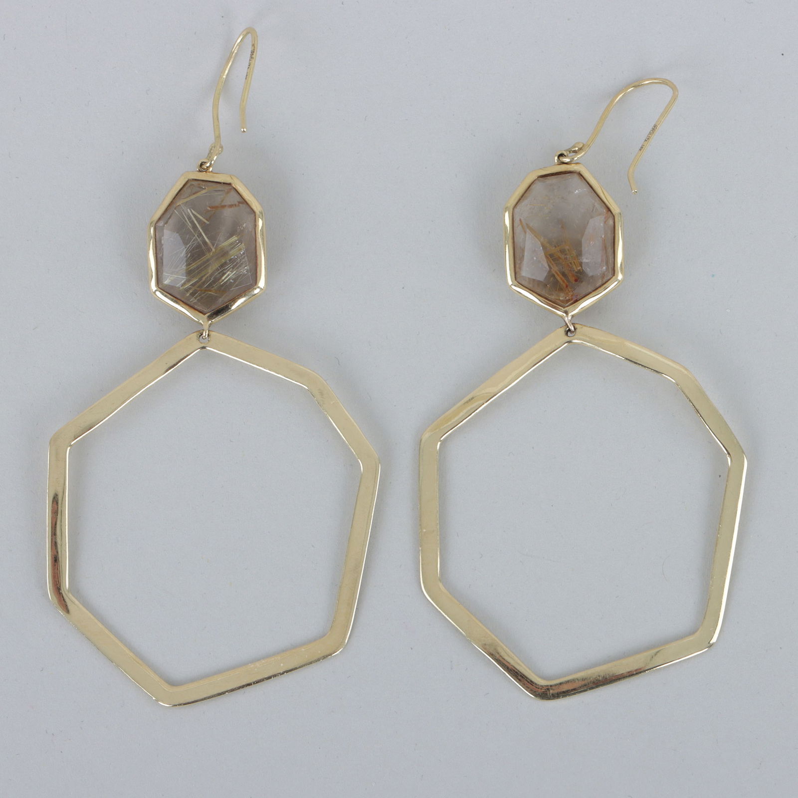 Pair of Ippolita 18k Gold and Rutilated Quartz Earrings: Pair of Ippolita 18k Gold and Rutilated Quartz Hoop Earringseach having a seven-sided, faceted irregular-cut rutilated quartz drop over a hoop in a conforming shape, marked on hooks.Length (excluding