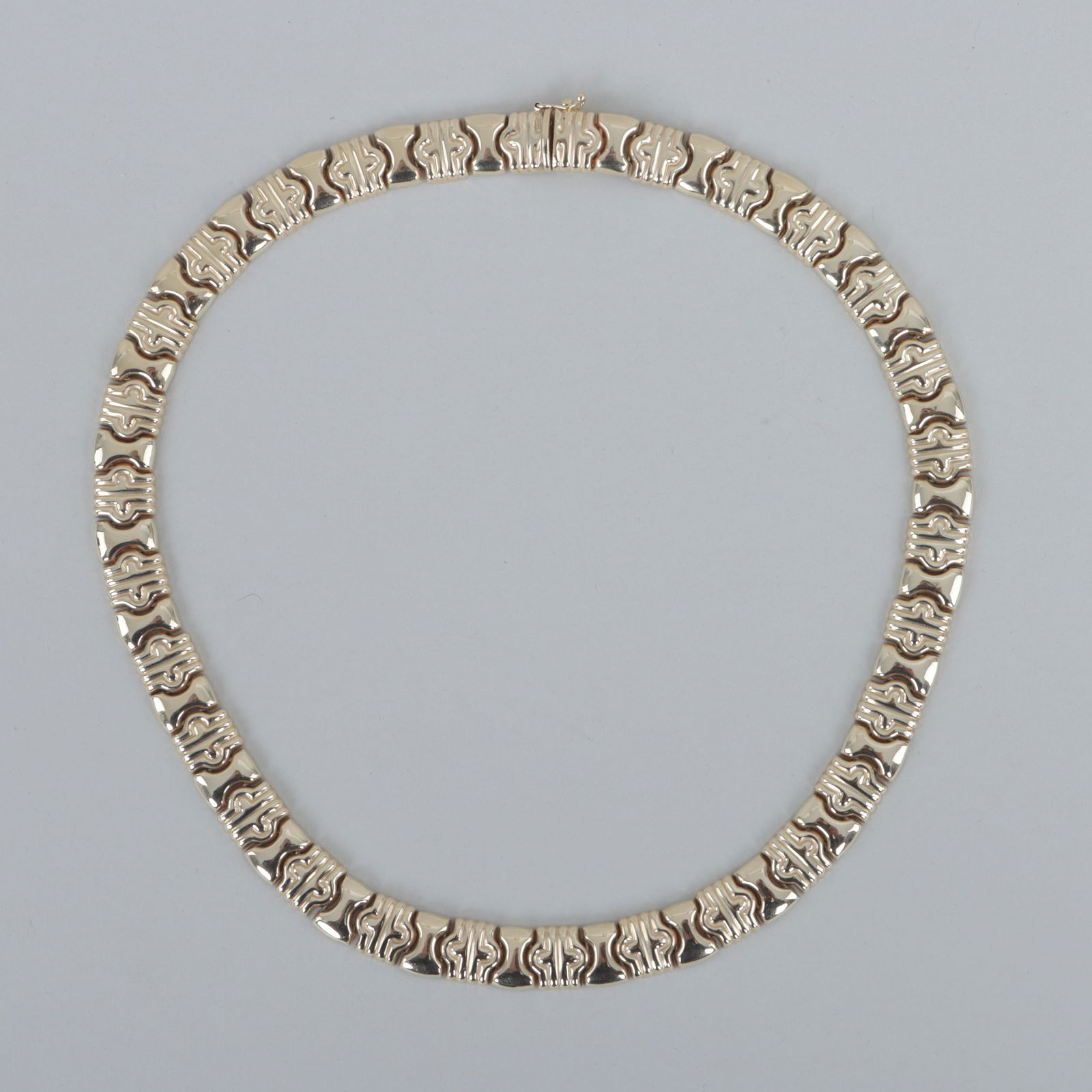 14k Gold Necklace with Shaped Chain Links: 14k Gold Necklace with Shaped Chain Linksalternating shaped links with geometric design and hourglass-form links, marked on clasp.Length (open) 15 1/2 in. (39.4 cm.); approximate weight 26.0 dwt.