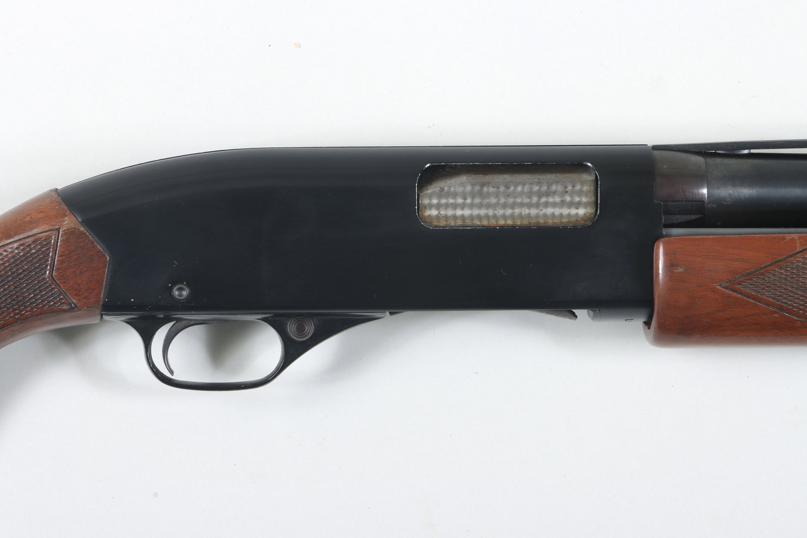 Winchester M1200 Pump Shotgun: Winchester M1200 Pump Shotgun with Winchokes, 12 Gauge, 2-3/4" The vent rib barrel measures 28" with three Winchoke choke tubes. The stock shows some wear at the bottom of the stock; the forearm is in