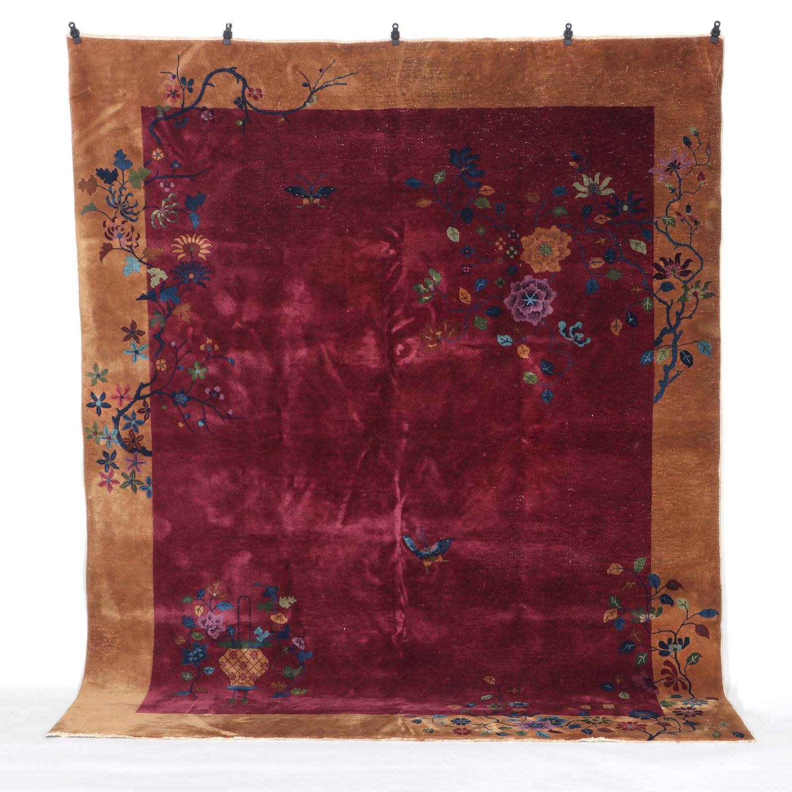 Nichols Art Deco Rug: Nichols Art Deco Rug decorated with flowers, urns and insects, having burgundy center with light brown border. 95 x 118 in. (241.3 x 299.7 cm.)