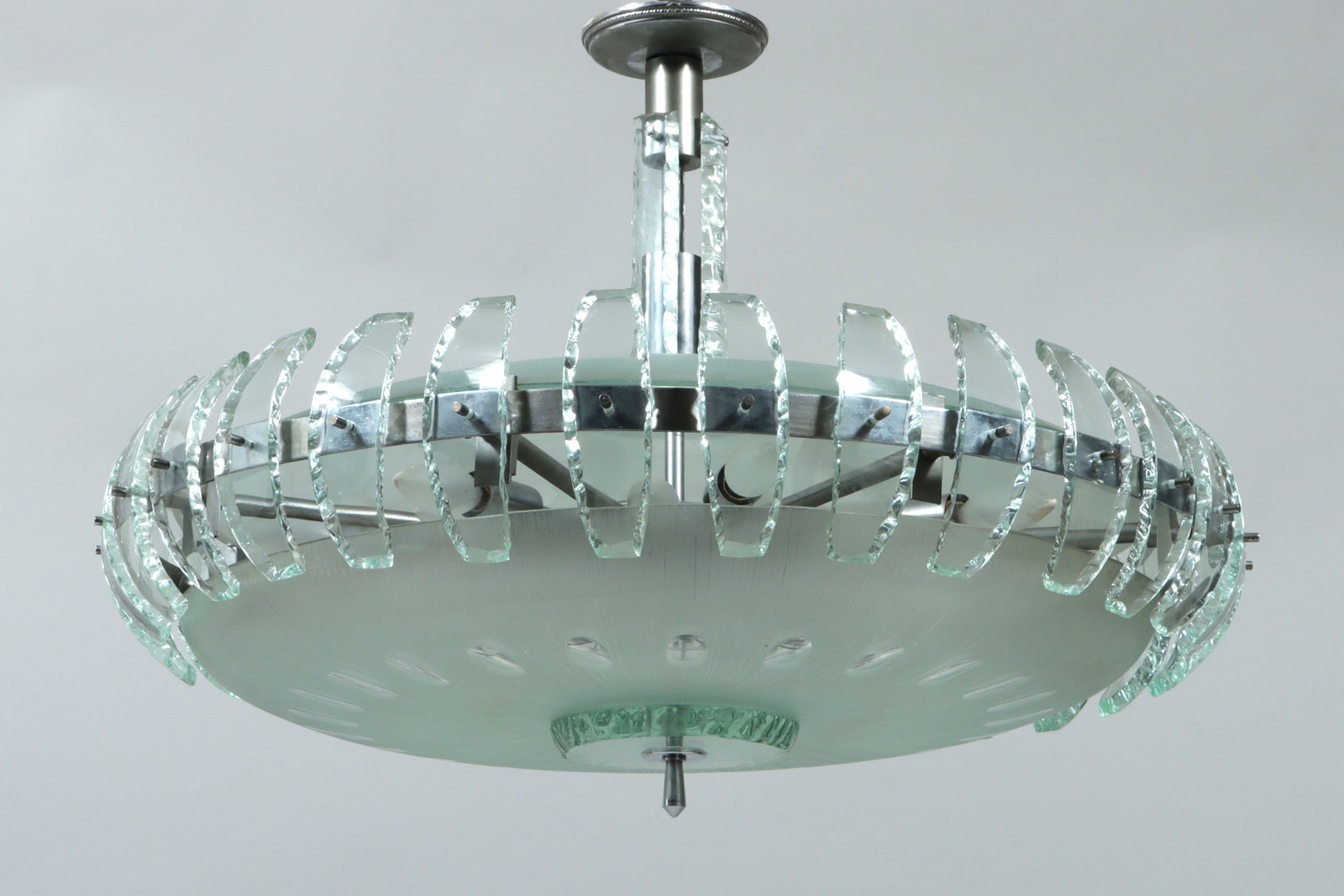 Midcentury Fontana Arte Style Chandelier: Midcentury Modern Fontana Arte Style Chandelier having a stainless-steel frame with cut and chiseled, green-tinted glass shade. 21 1/2 x 30 in. (54.6 x 76.2 cm.)