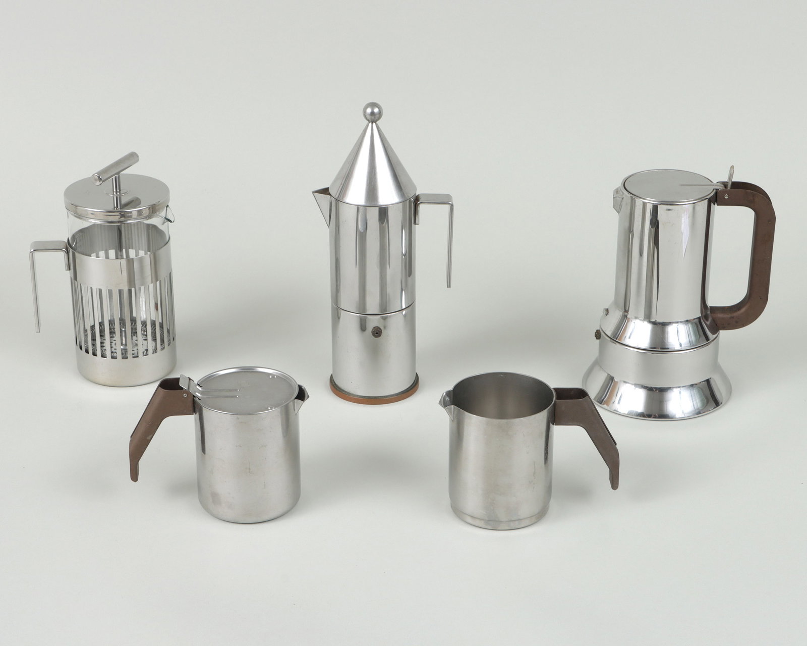 Group of (5) Alessi Coffee Serving Items: Group of (5) Alessi Coffee and Tea Serving Items designed by Richard Sapper (German, 1932-2015) or Aldo Rossi (Italian, 1931-1977), Italy, 20th century with stainless steel bodies, to include: 9090 es
