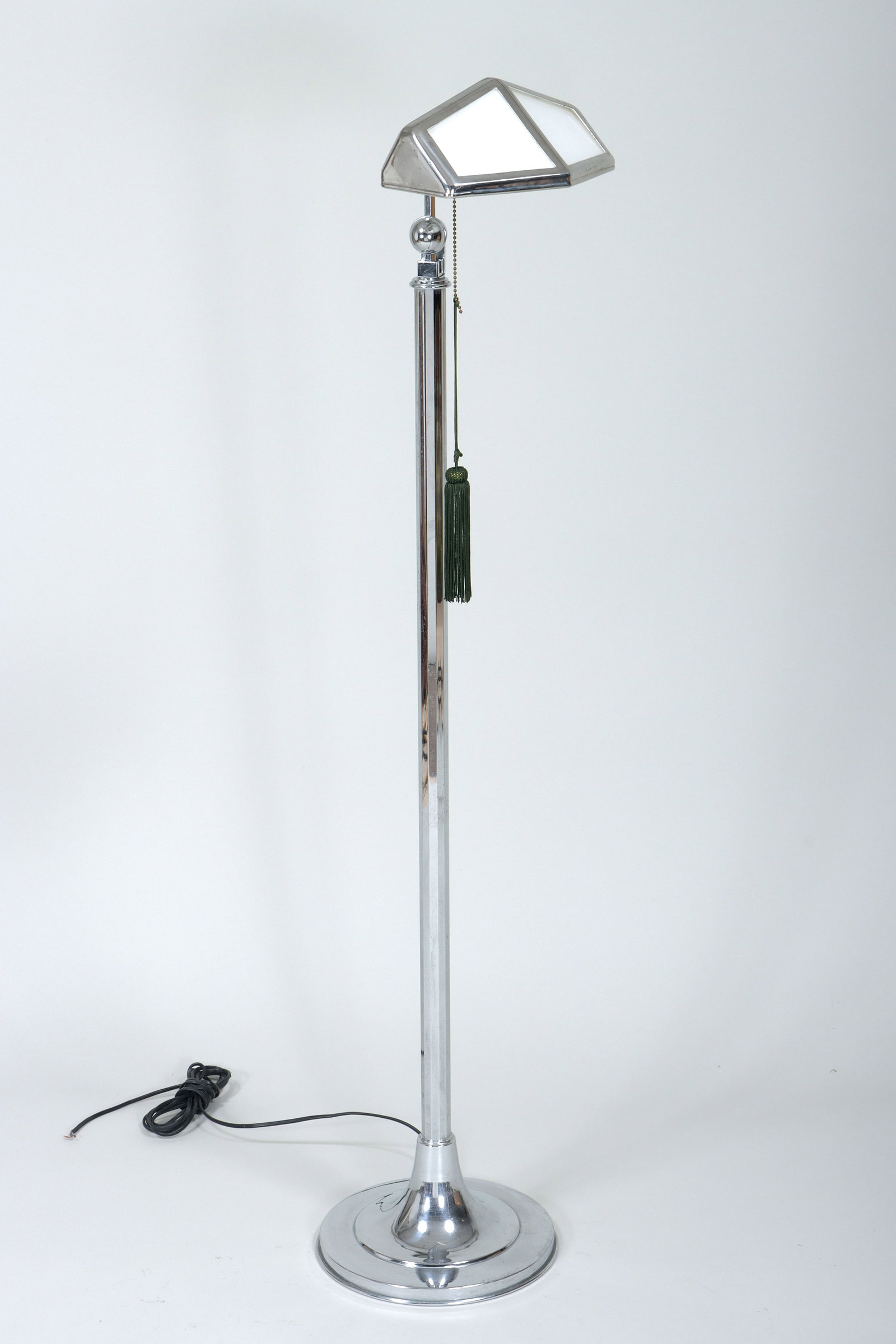 Art Deco Pirouette Floor Lamp: Art Deco Pirouette Floor Lamp France, c. 1930s chrome or chrome-plated, having adjustable shade with white glass panels, pull cord with tassel, and faceted column over a round base. Height (with shade