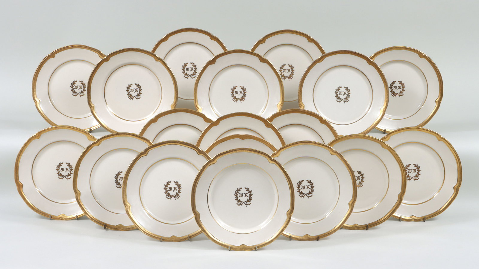 Waldorf Astoria Hotel Dinner Plates: Set of (18) Waldorf Astoria Hotel Dinner Plates in variations of the Waldorf Astoria pattern, all having gilt scalloped edge with alternating stars and trefoils, made by Sterling China, Wellesville, O